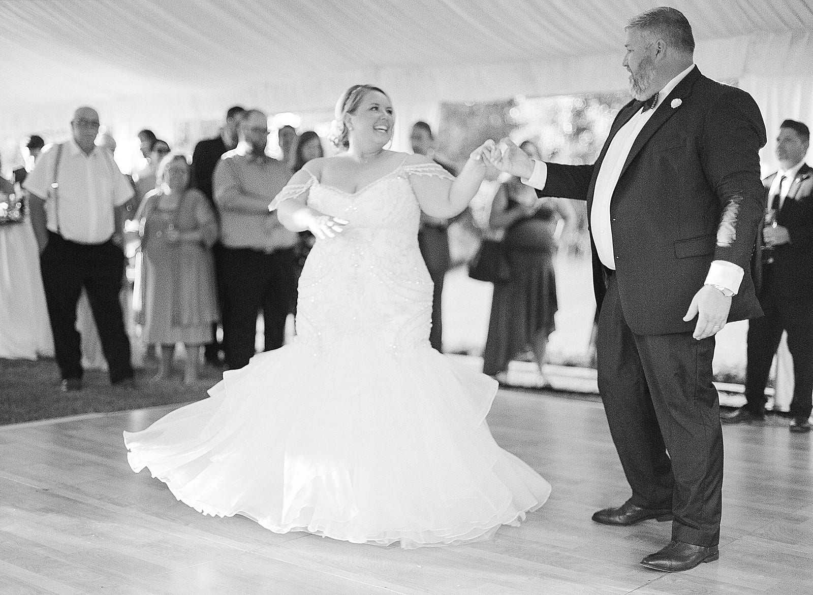 Black and White of Bride and Groom Dancing Photo