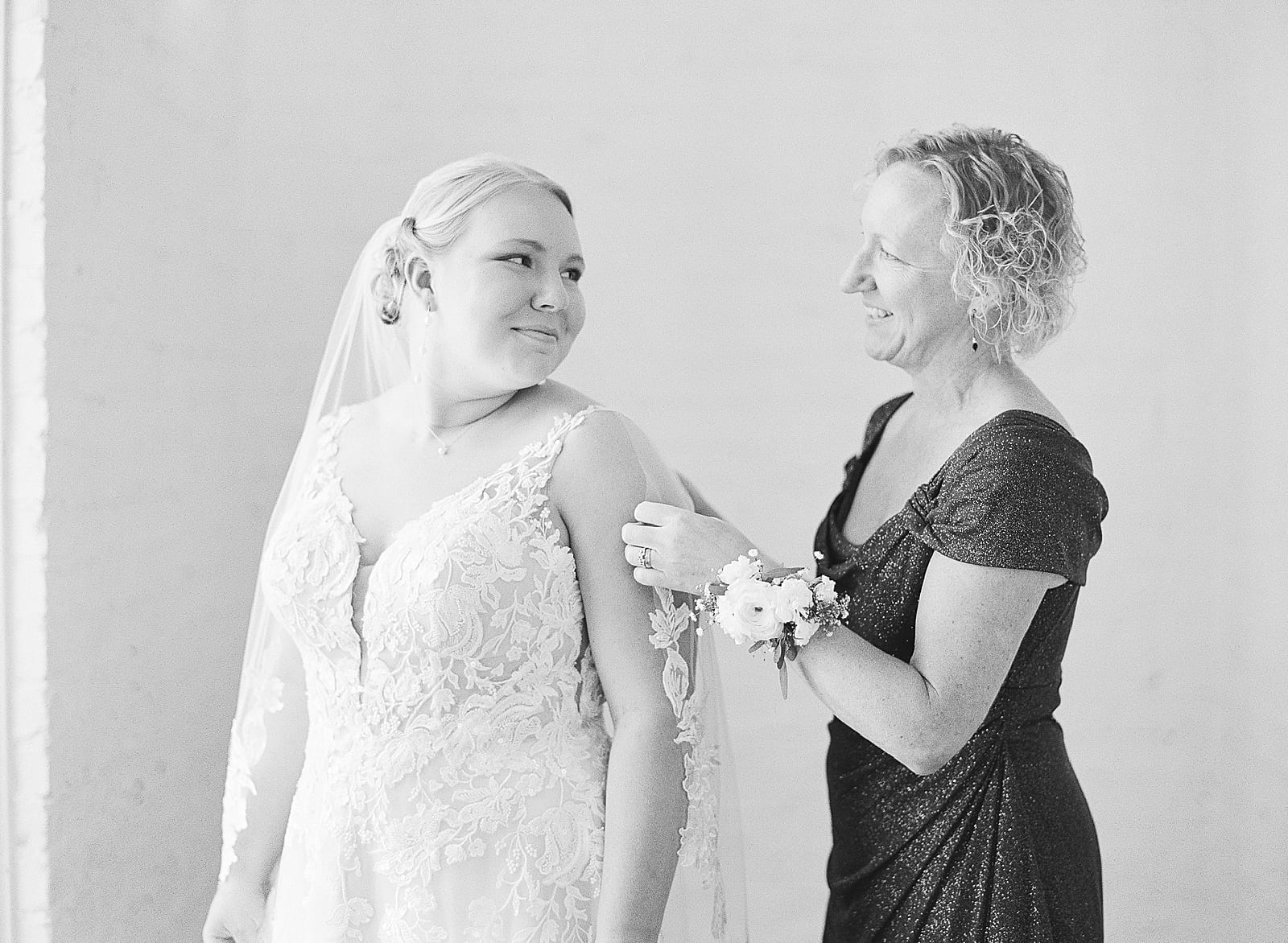 Black and White of Mother of Bride putting on Brides Veil Photo