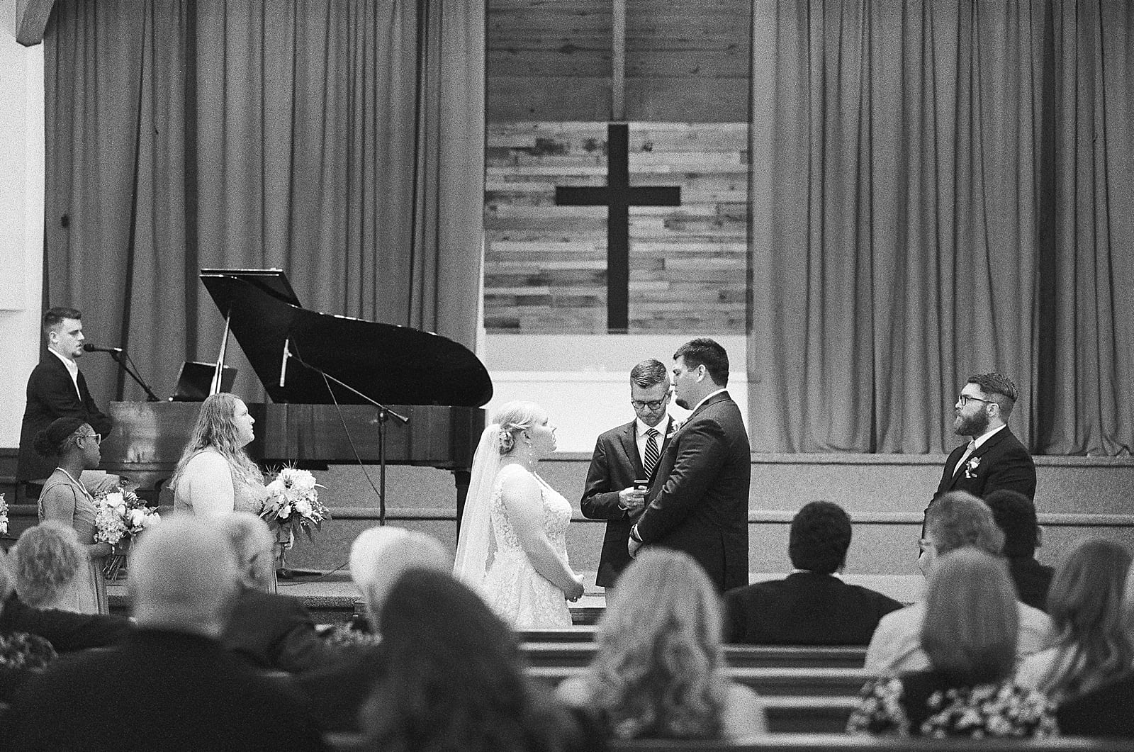 Black and White of Bride and Groom During Ceremony Photo