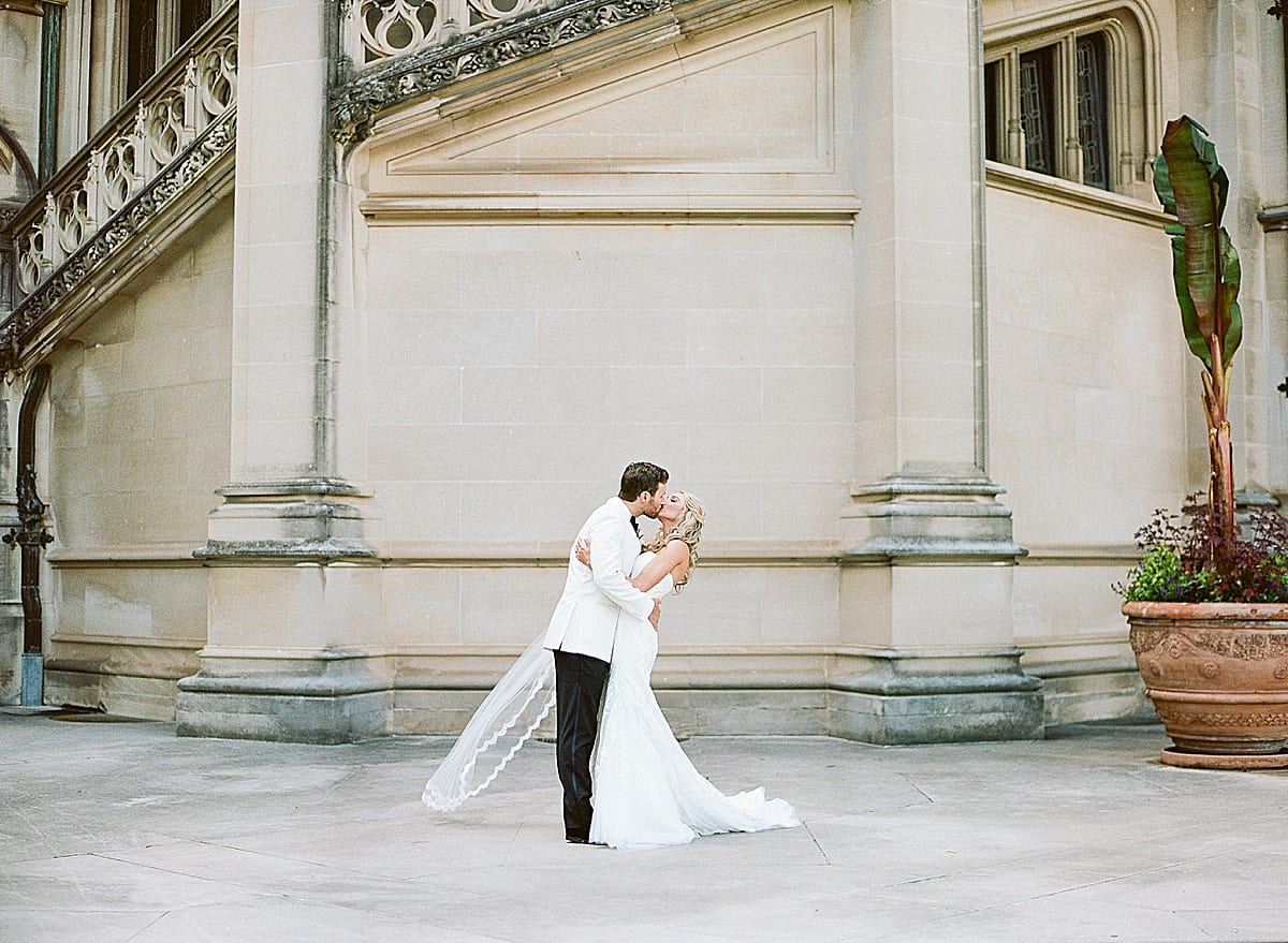 Biltmore Wedding Kissing in Front of Estate Photo