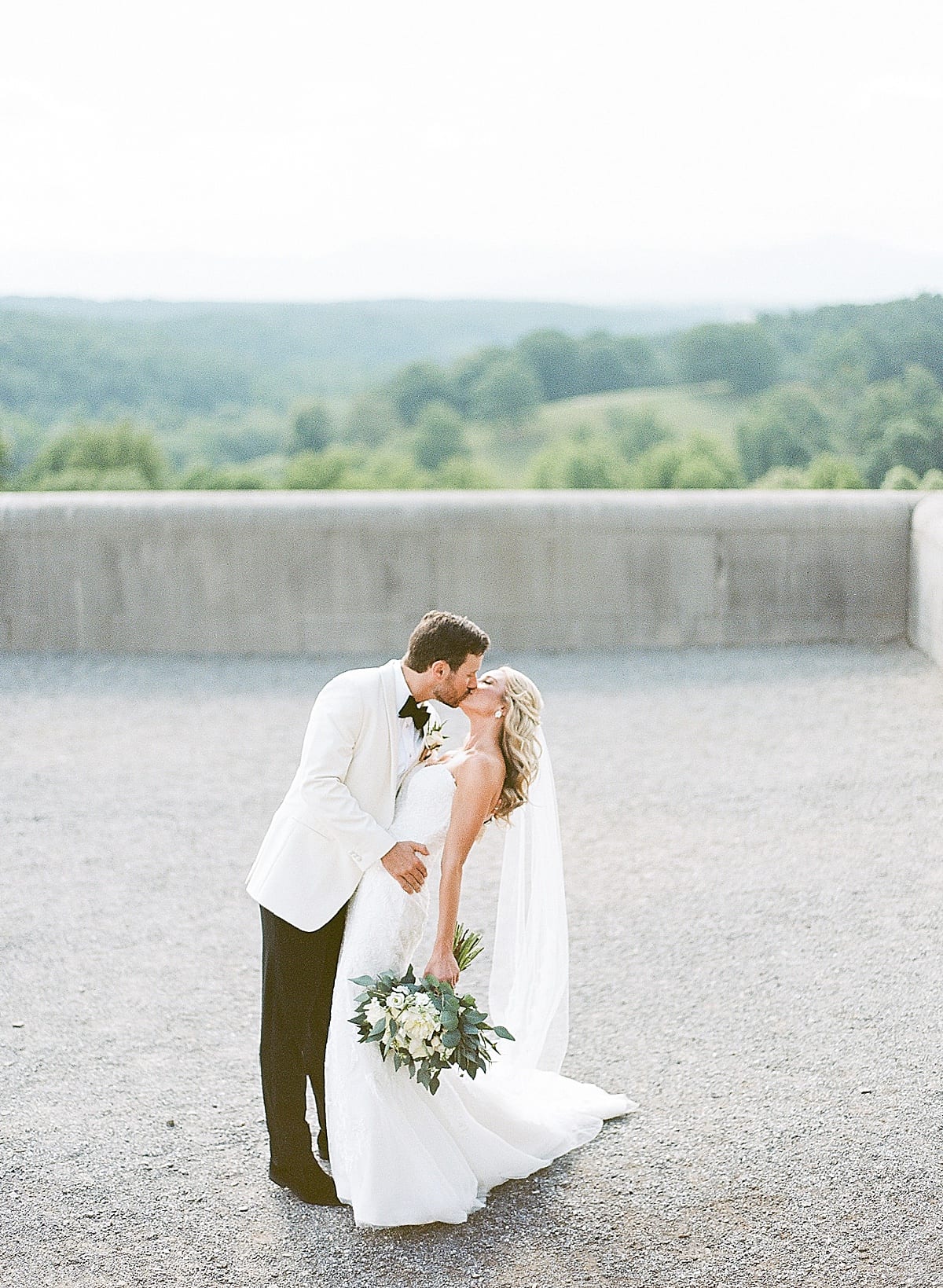 Biltmore Wedding Bride and Groom Kissing On Terrace Photo