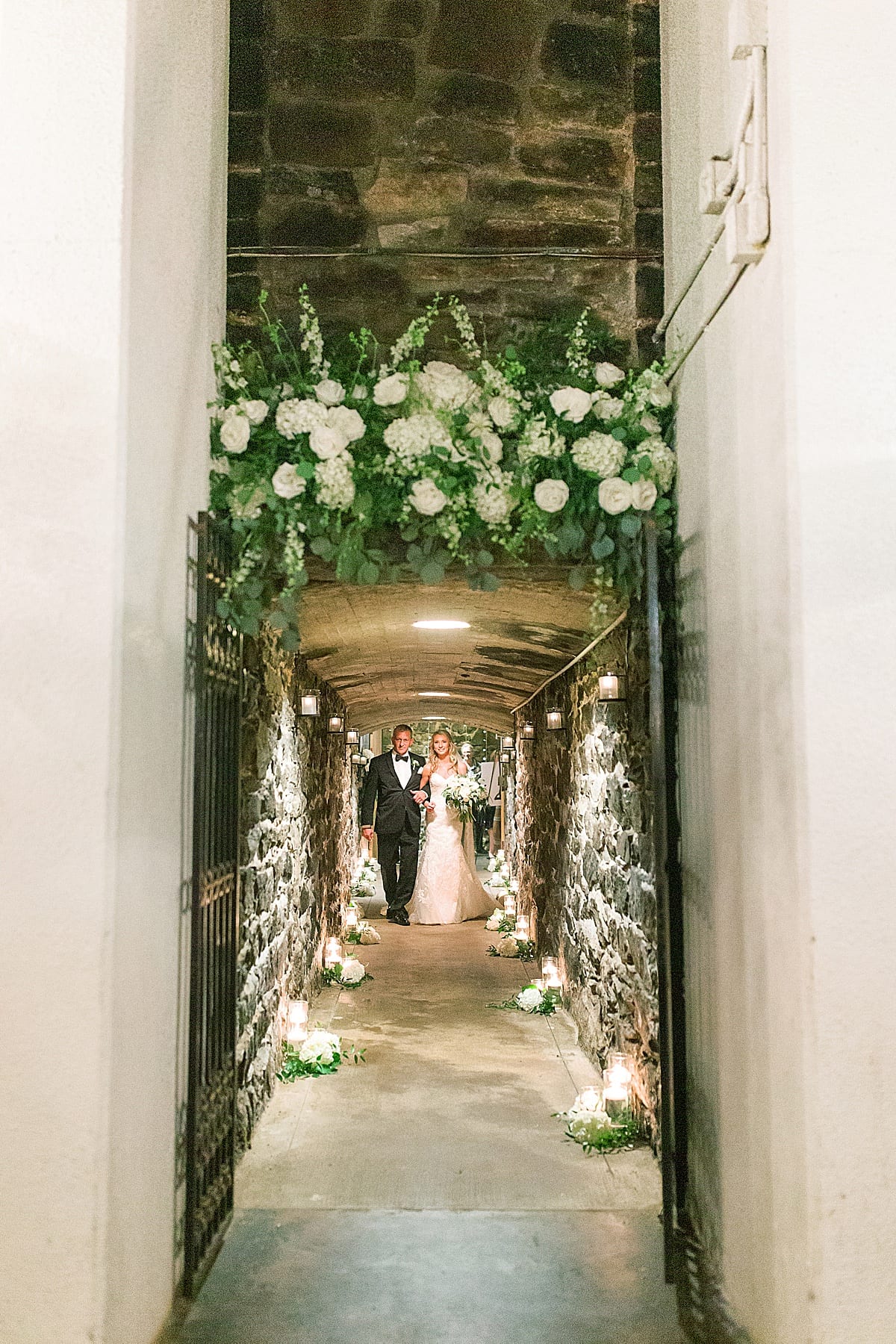 Biltmore Wedding Bride and Dad Walking Down Aisle In Champagne Cellar Photo