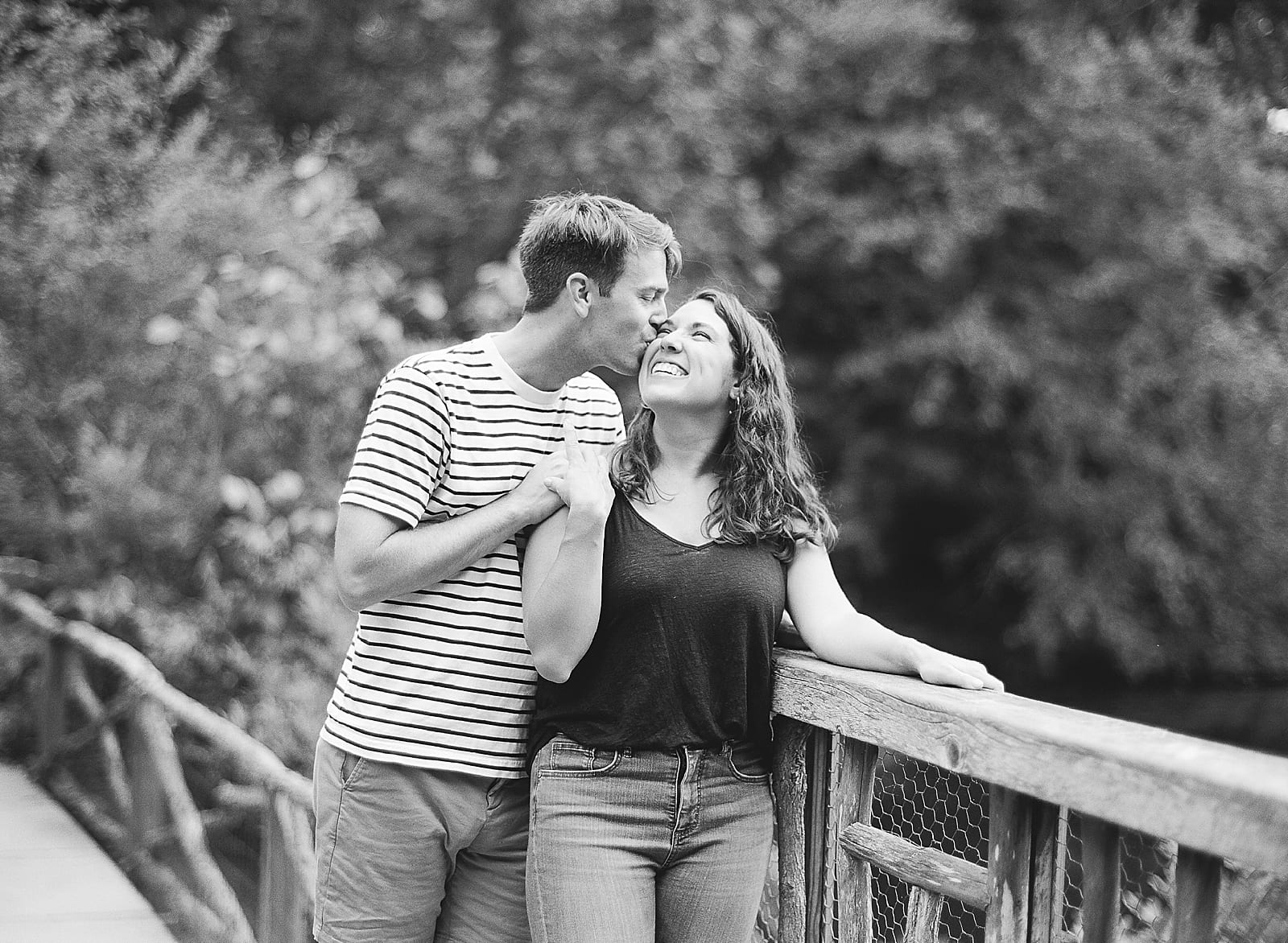Romantic Biltmore Locations Black and White of Couple Kissing On Bridge Photo