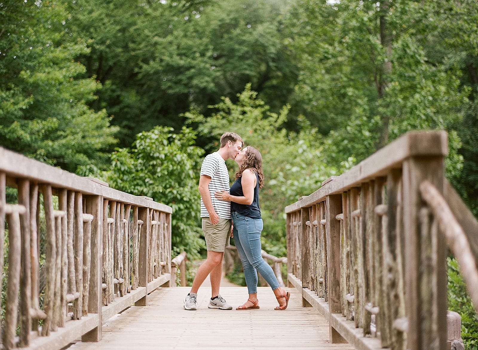 Romantic Biltmore Locations Couple Kissing on Bridge at Bass Pond Photo