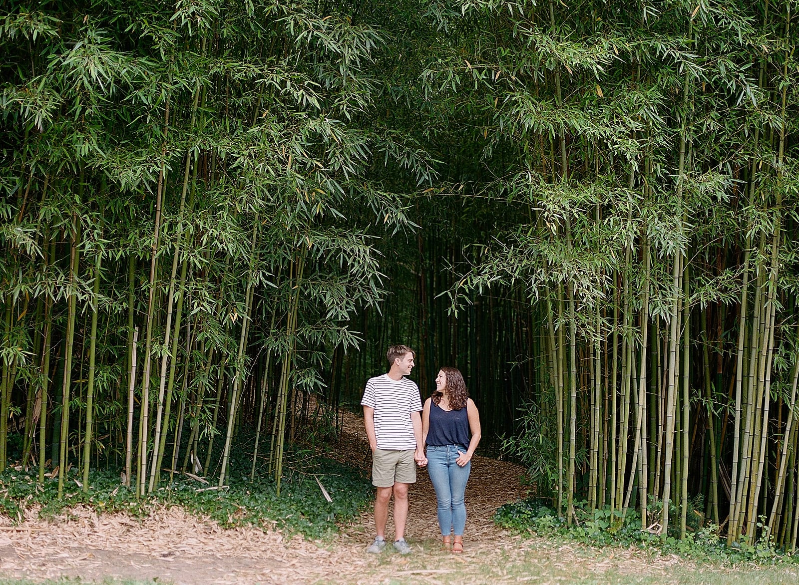 Romantic Biltmore Locations Couple Holding Hands at Bamboo Forest Photo