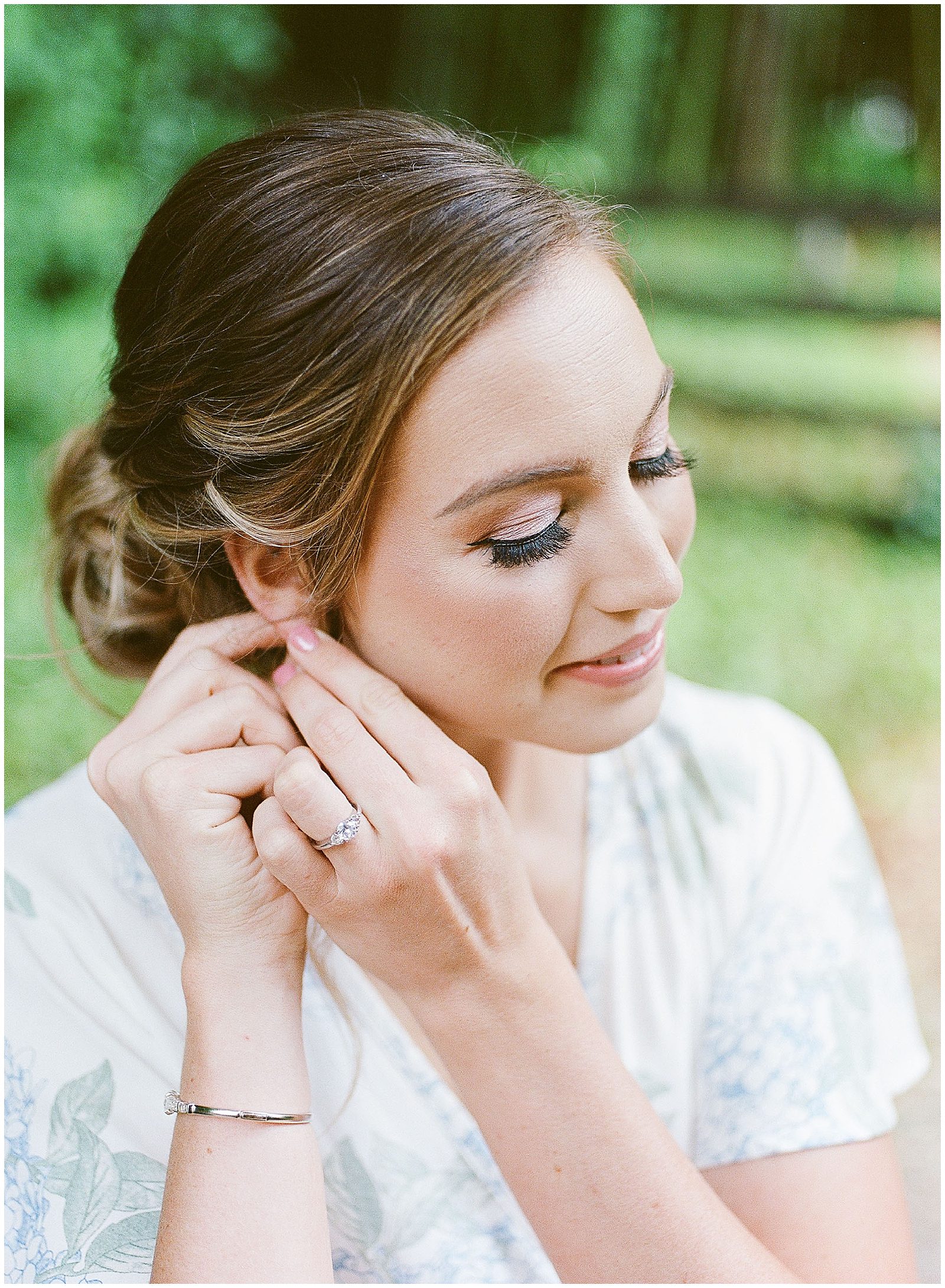 Bride Putting in Earrings Photo
