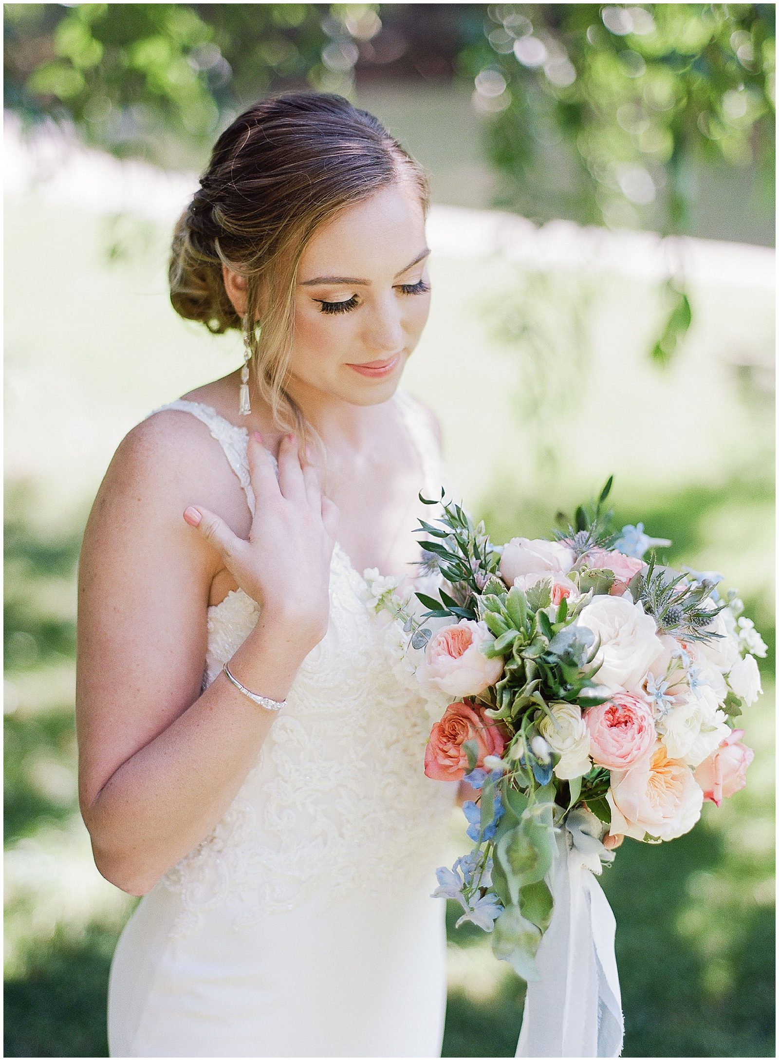Wedding Colors For Summer Bride Looking Down Holding Bouquet Photo