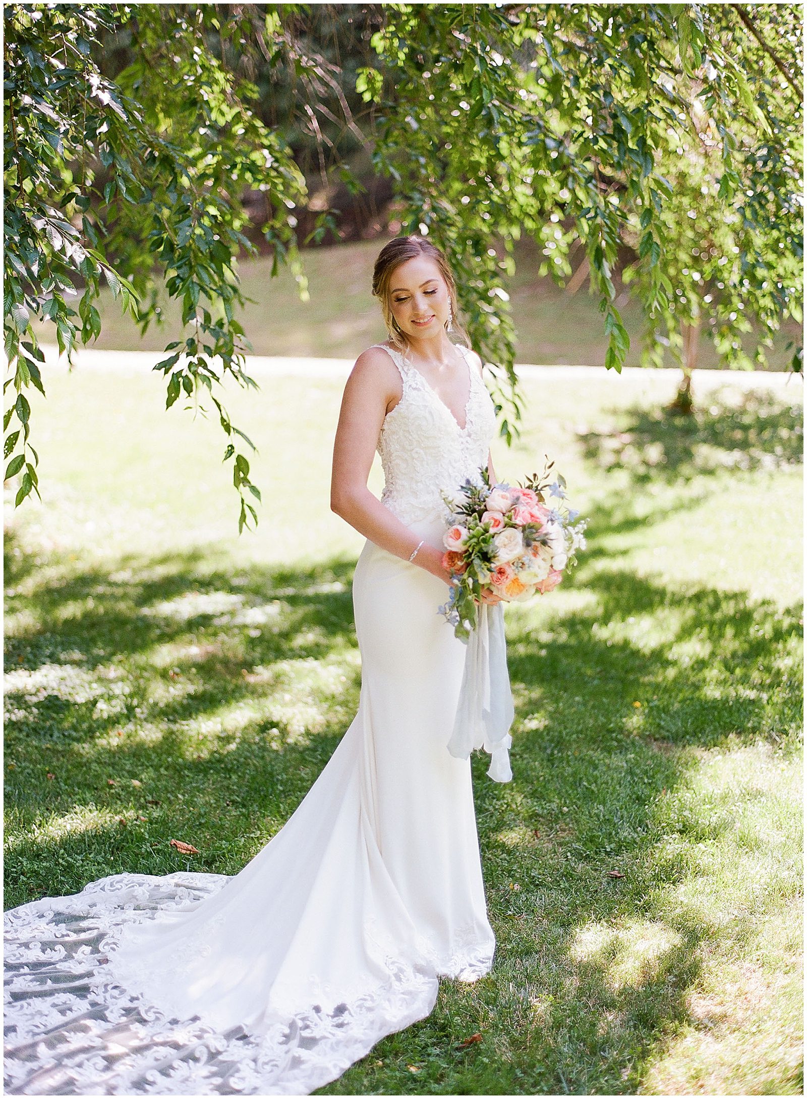 Bride Looking Over Shoulder Holding Bouquet Photo