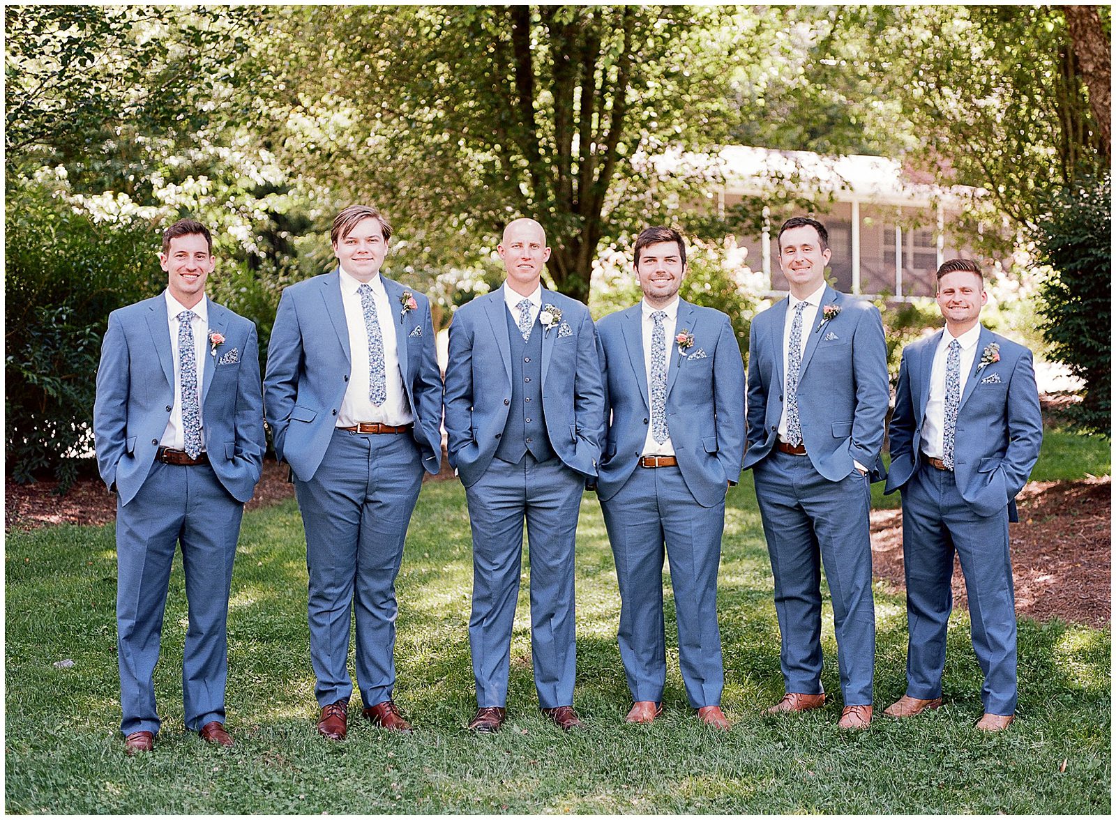 Groom with Groomsmen Smiling at Camera Photo