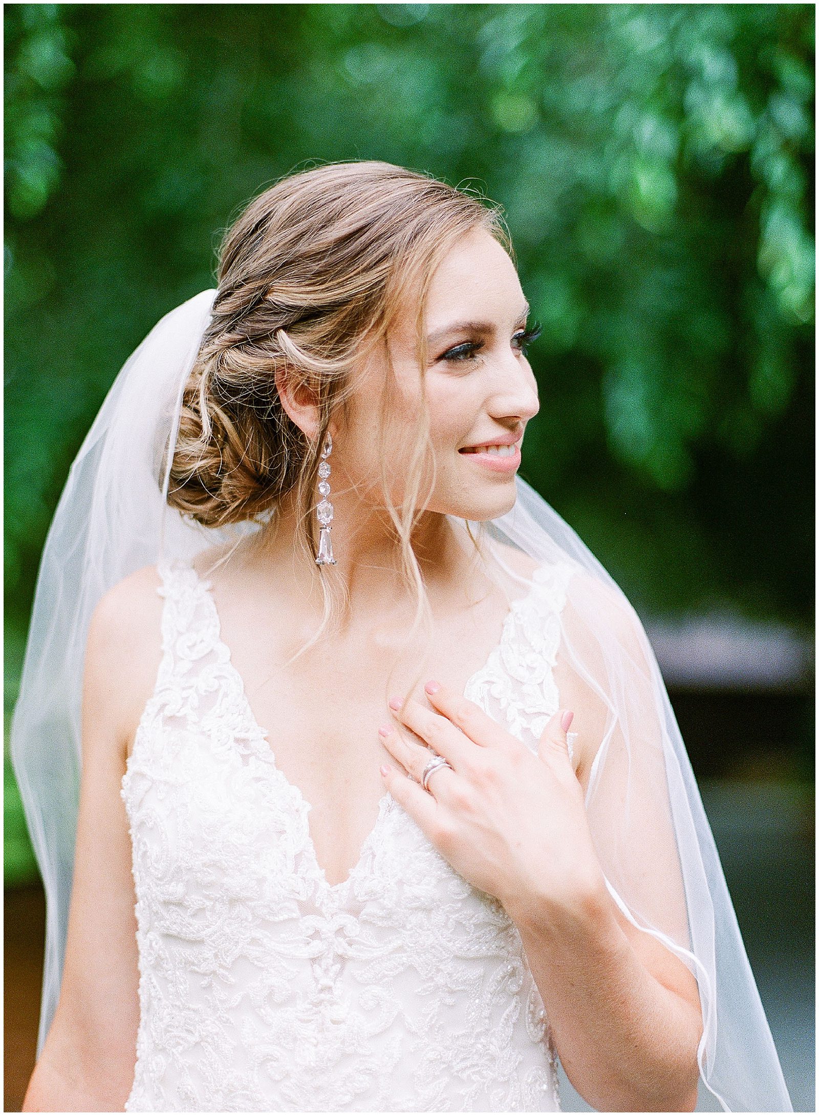 Bride Looking Off With Hand On Chest Photo