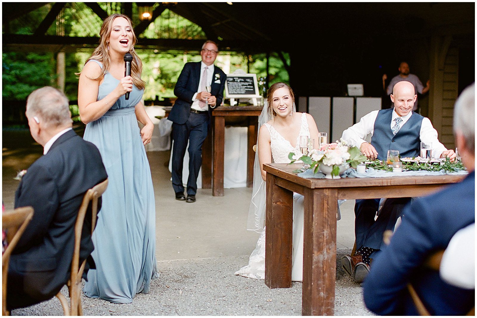 Maid of Honor Wedding Toast Bride and Groom Laughing Photo