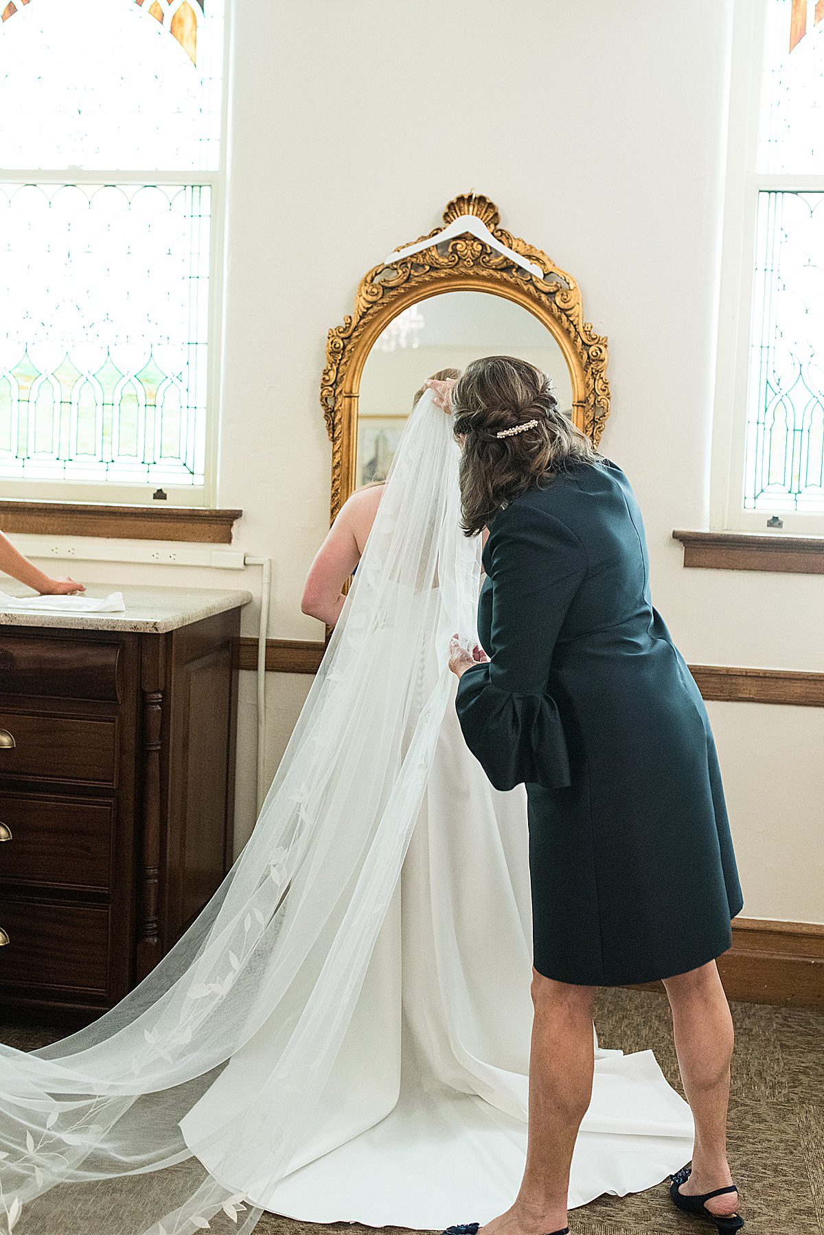 Mother Of Bride Putting In Her Veil Photo