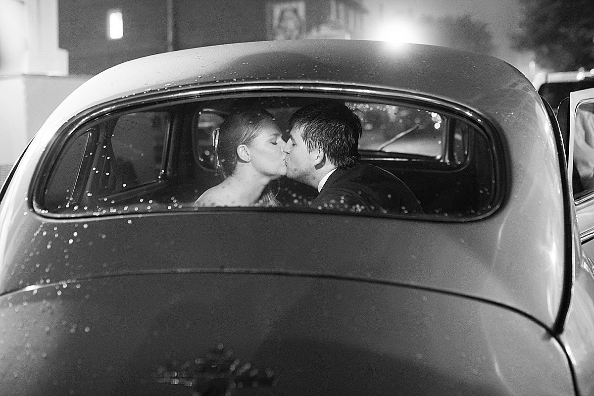 Asheville North Carolina Wedding Reception at The Venue Black and White of couple in Car Kissing Photo