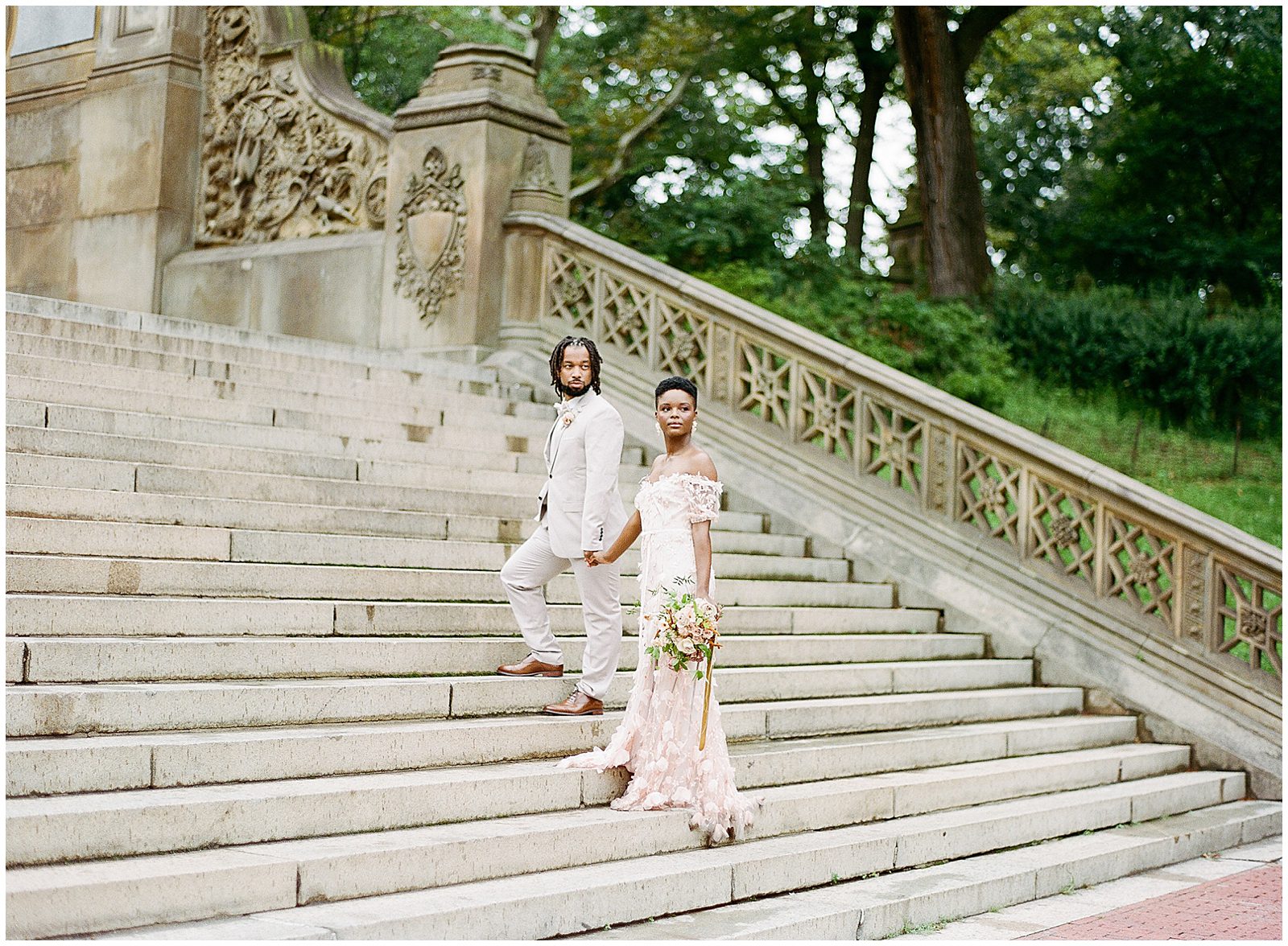 Central Park Wedding Bride and Groom Walking up Bethesda Terrace Stairs Photo