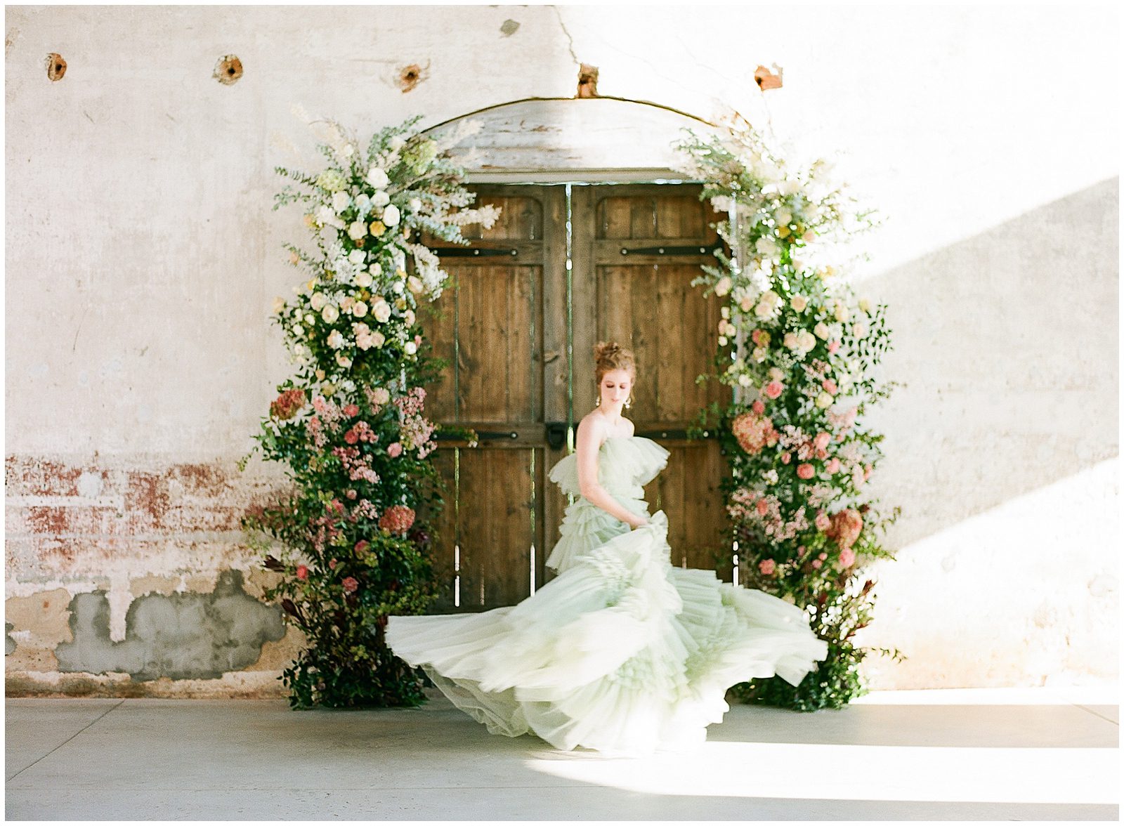 Bride Twirling in Green Wedding Dress Photo