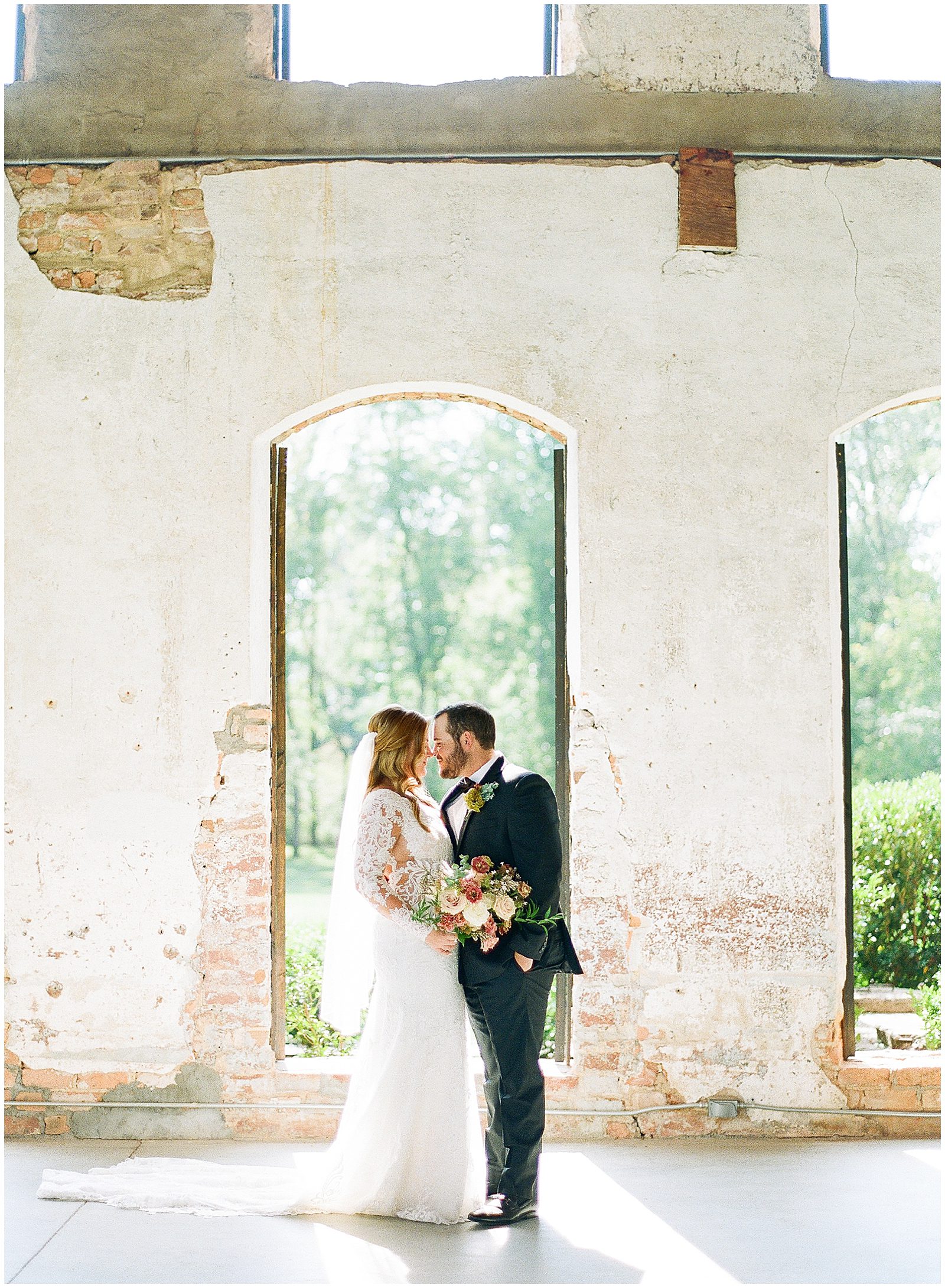 Providence Cotton Mill Wedding Bride and Groom Nose to Nose in Front of Window Photo