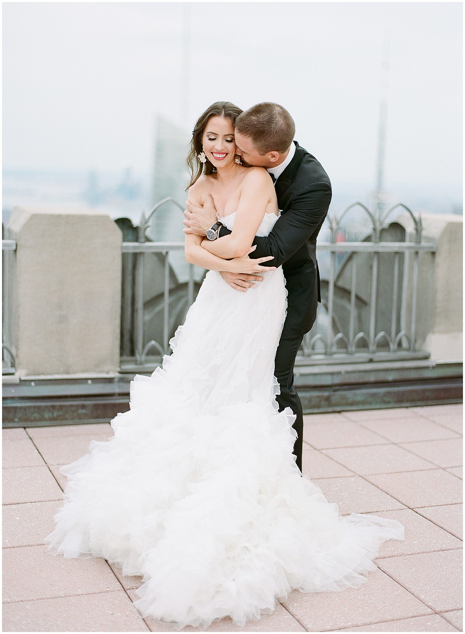 Couple Hugging and Snuggling at Top Of The Rock NYC Elopement Photo