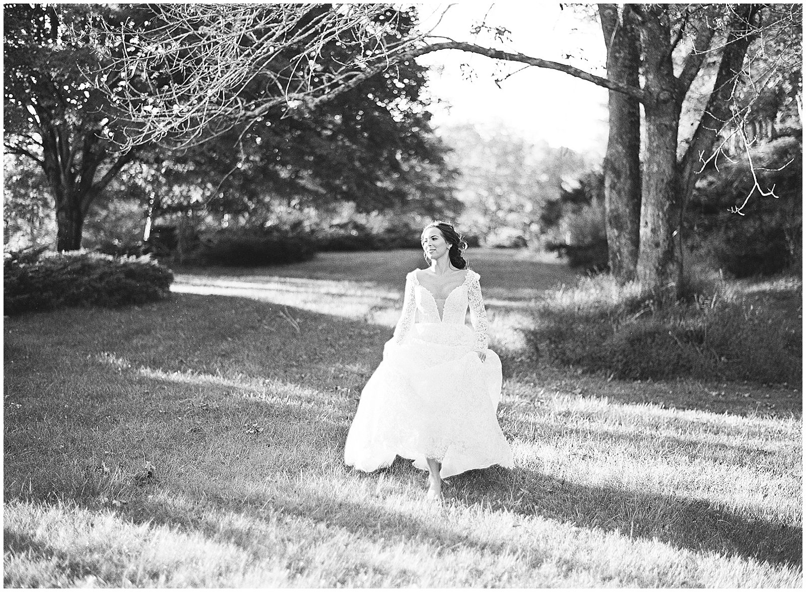 Black and White of Bride Running Toward Camera Photo