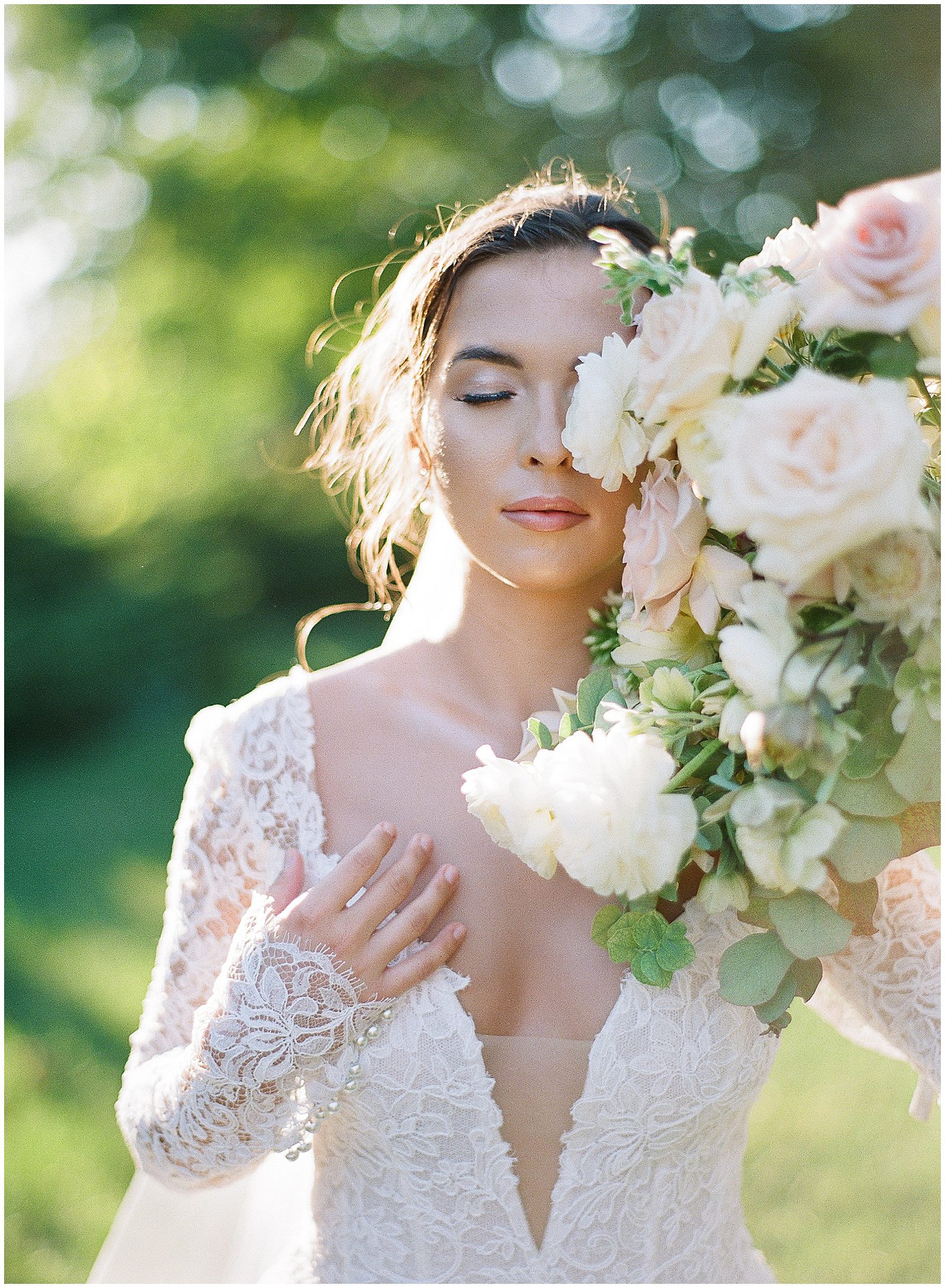 Bride with Flowers in Front of Her Face Photo