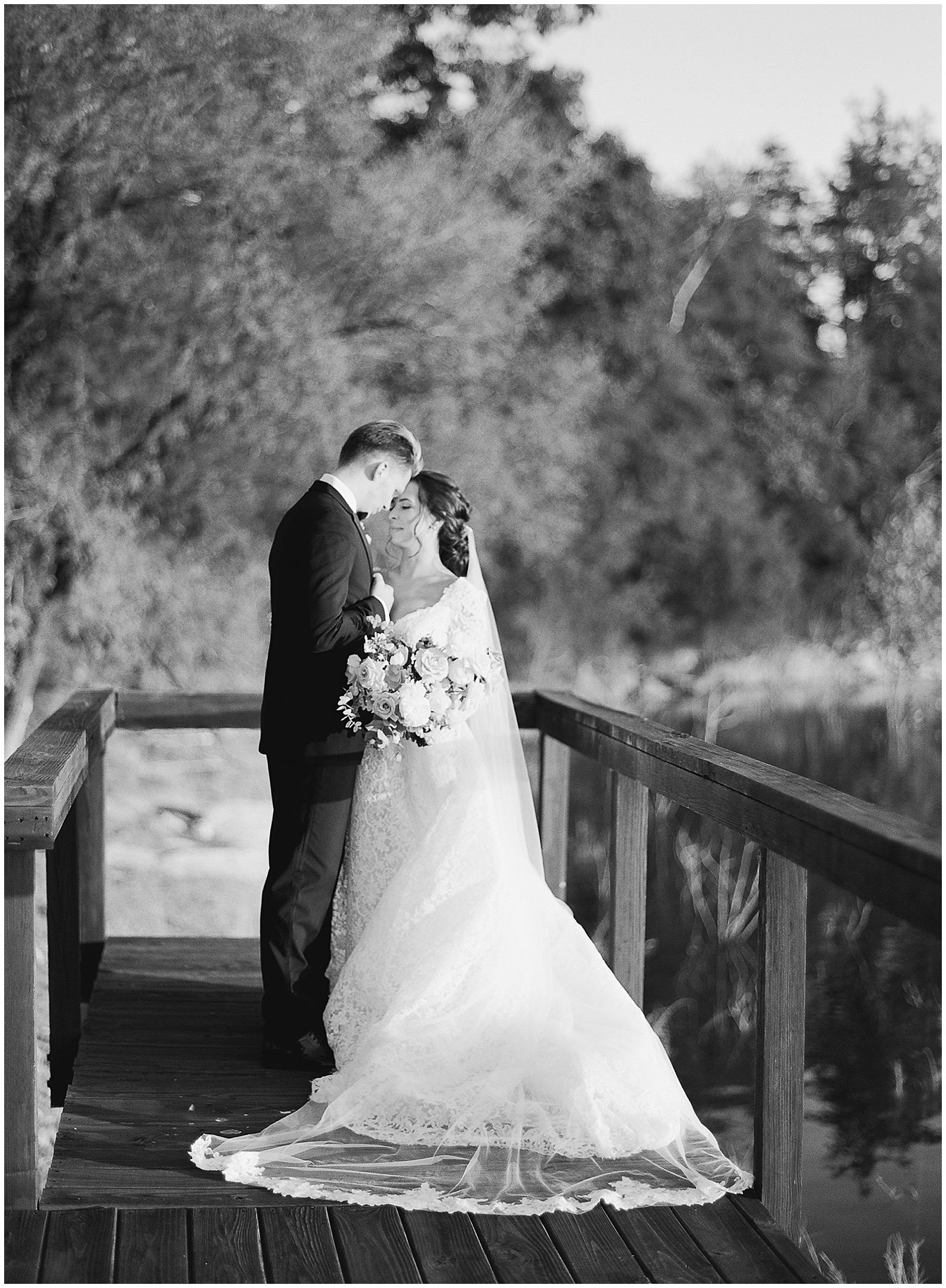 Black and White of Bride and Groom On Dock at Tennessee Wedding Venue The Lakehouse Photo