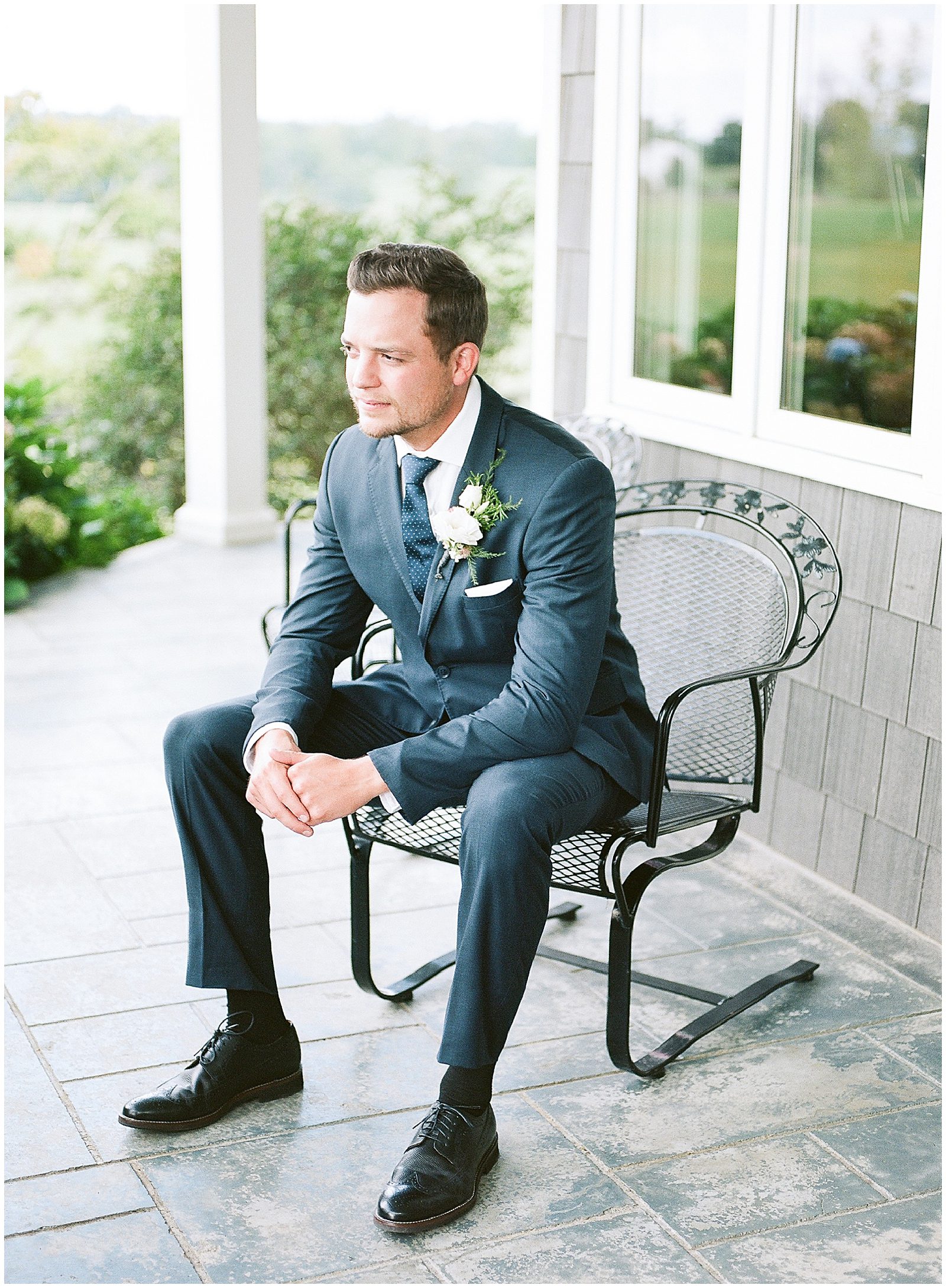Groom Sitting on Front Porch Photo
