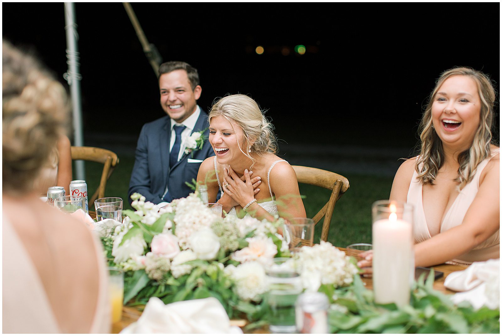 Bride and Groom Laughing During Toasts Photo