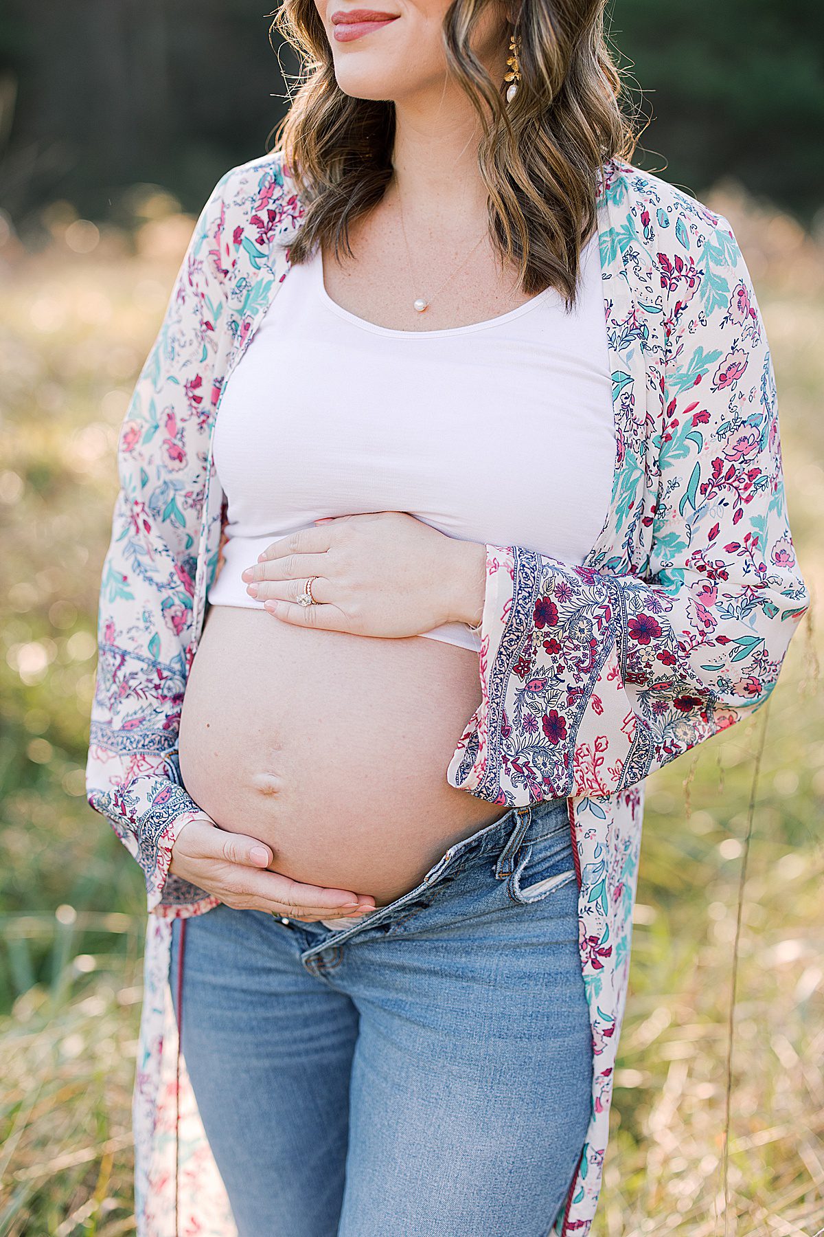Girl Holding Pregnant Belly Photo