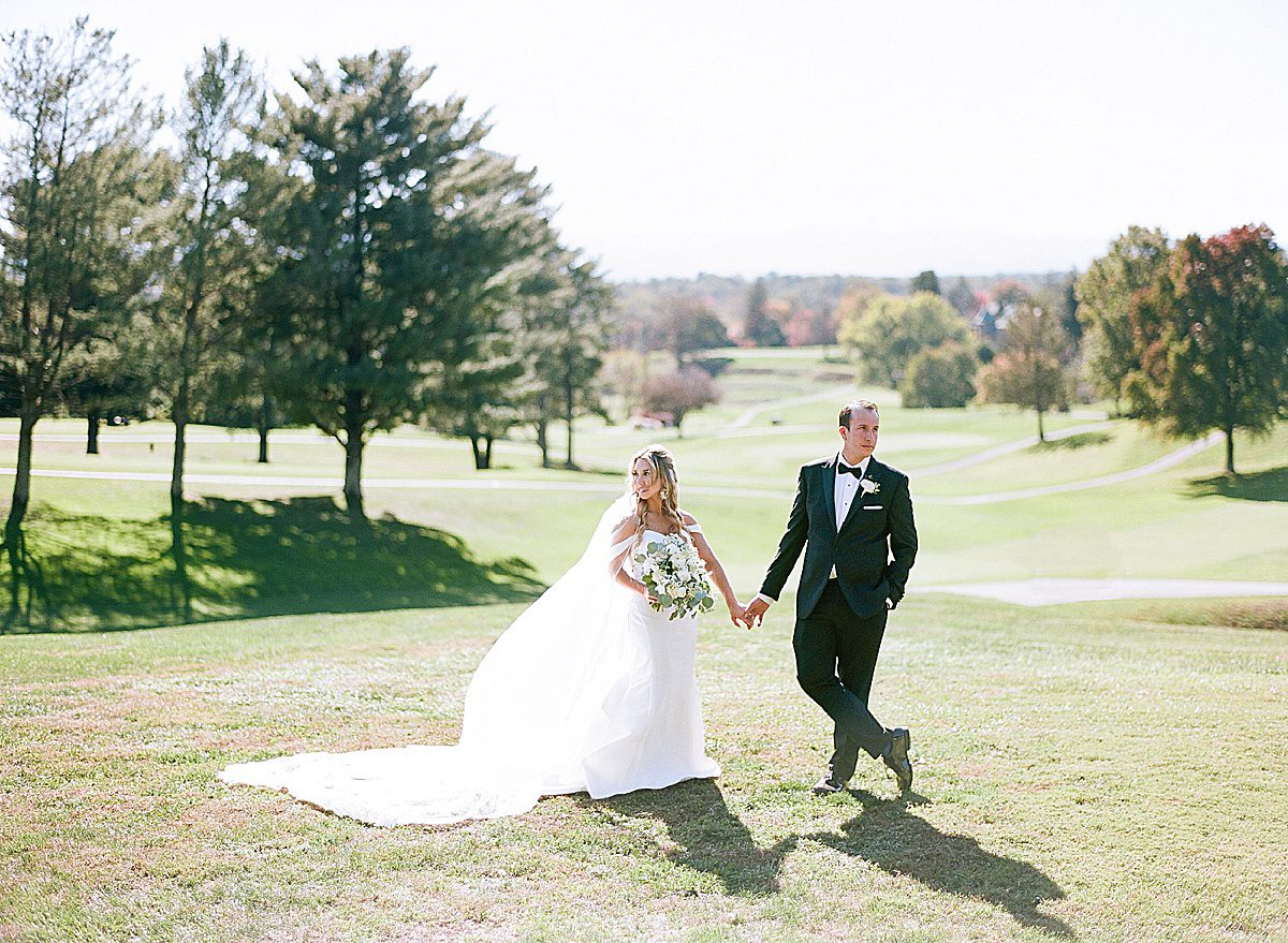 Bride and Groom Holding Hands at Omni Grove Park Inn Photo