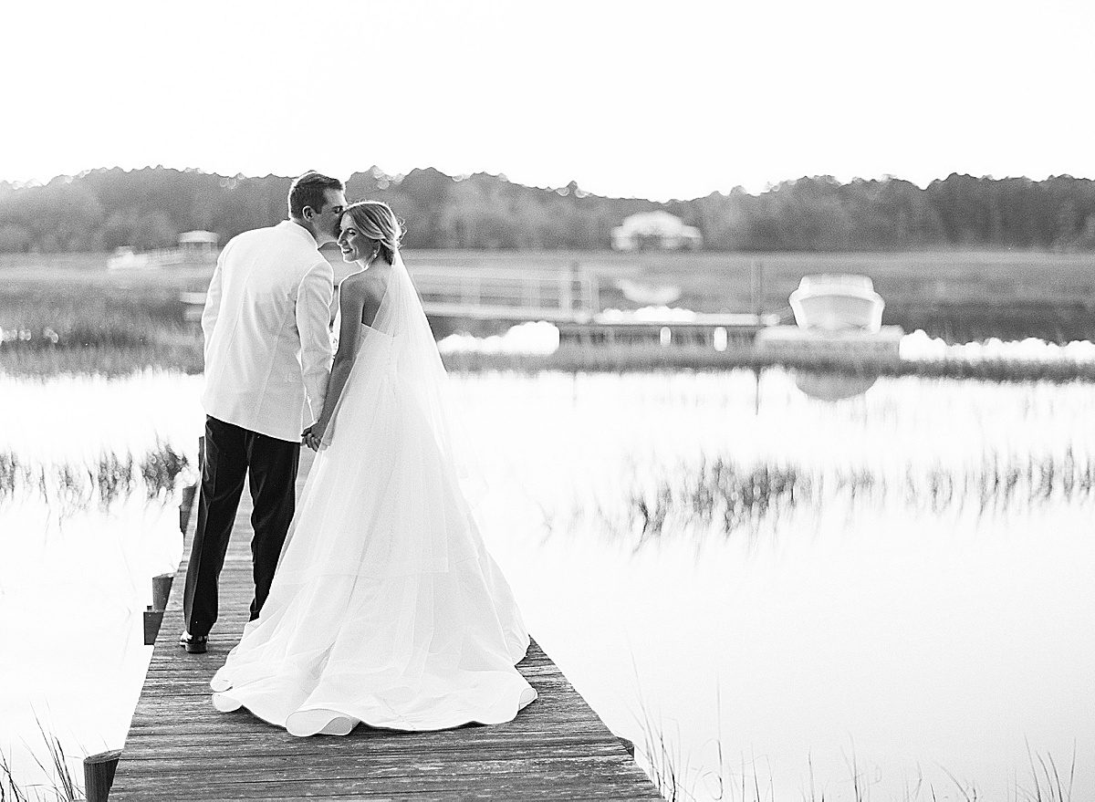 Wedding Venue In Charleston Black and White of Bride and Groom on Dock Photo