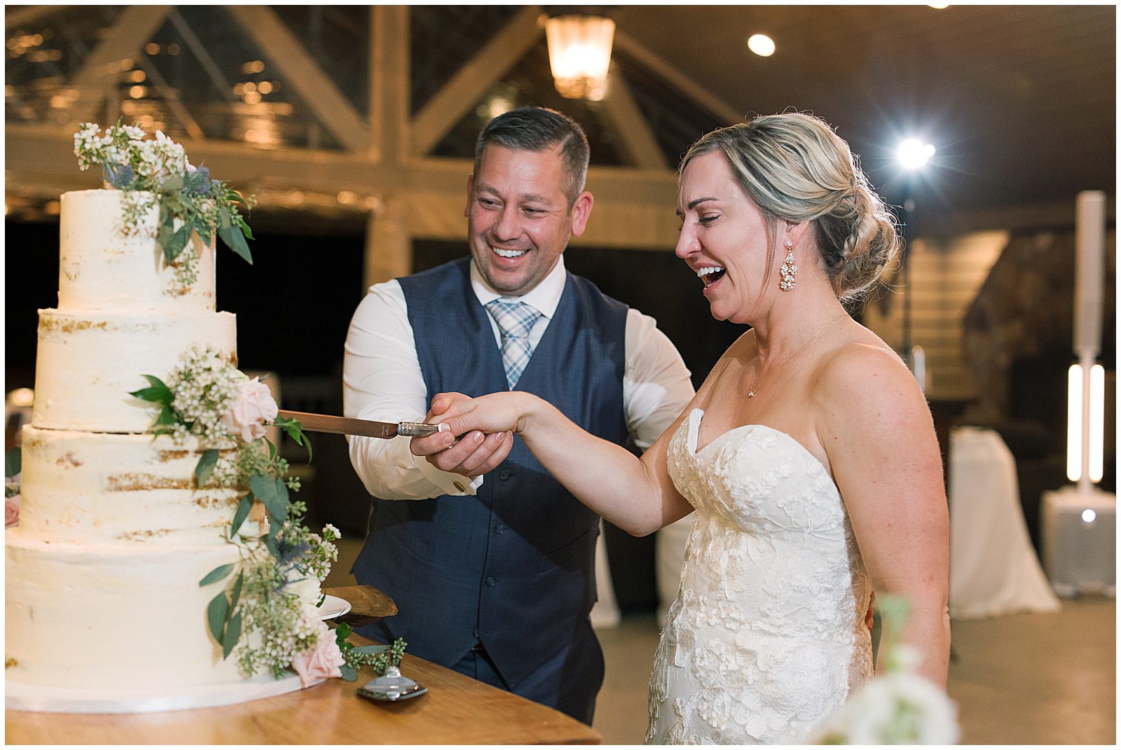 Bride and Groom Cutting Wedding Cake Photo