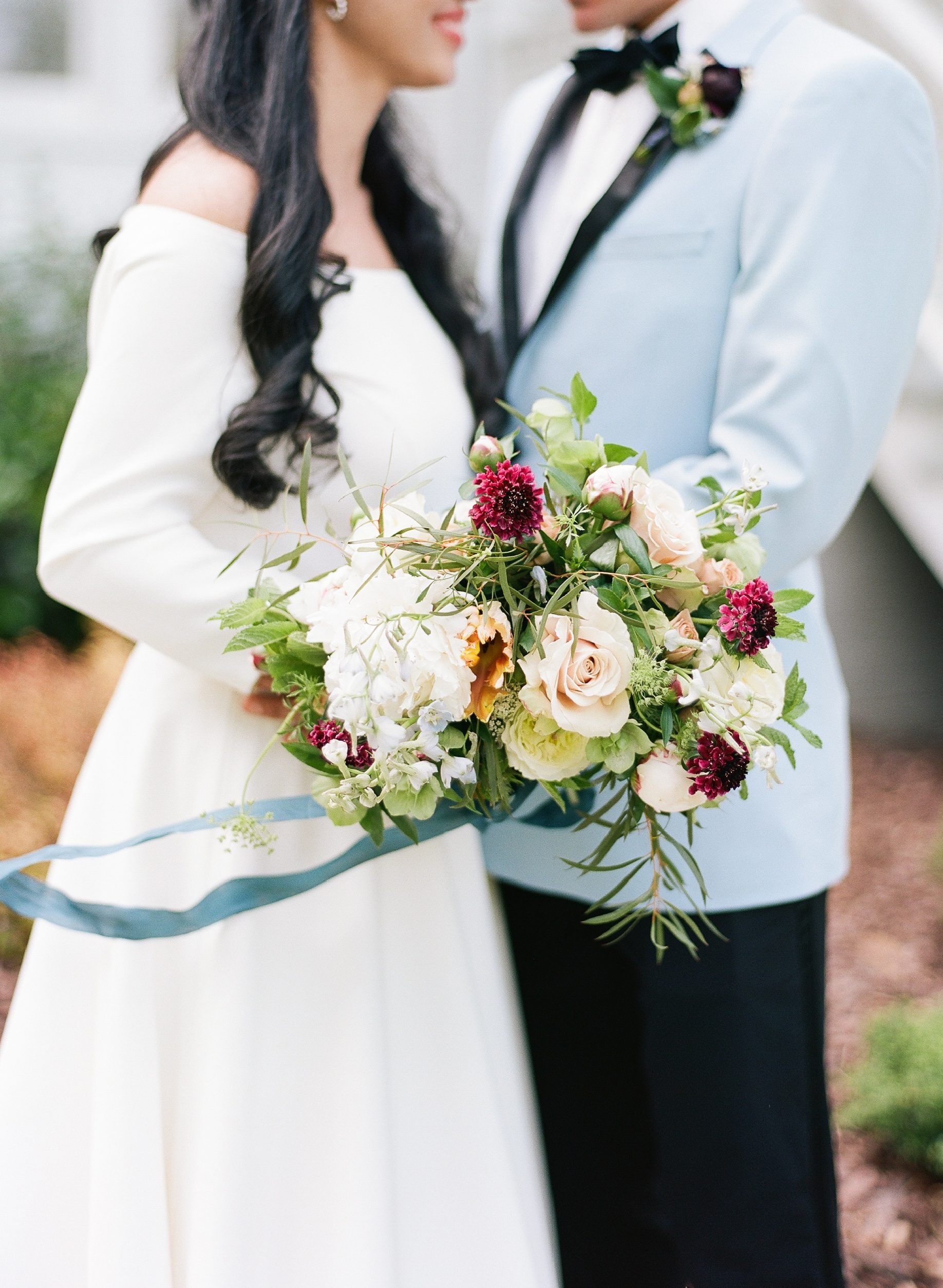 Bridal Bouquet Inspiration bride holding bouquet with teal ribbon photo