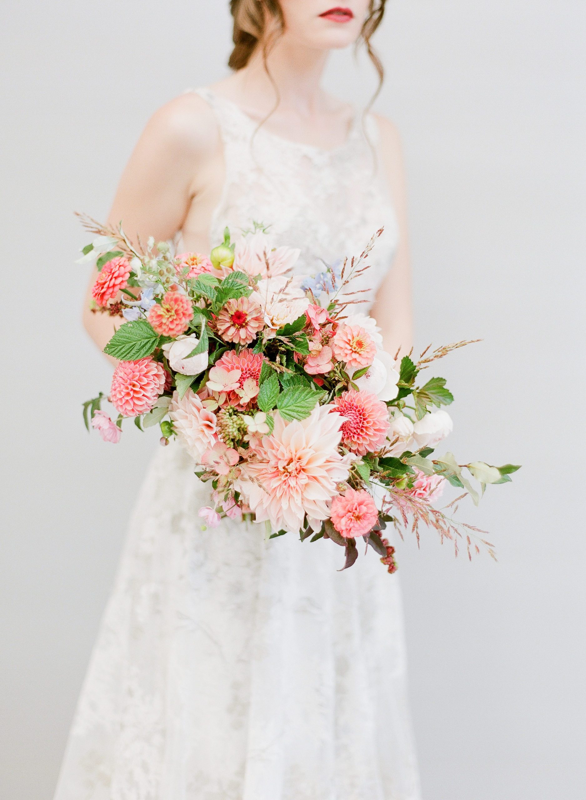 Bride holding pink bouquet photo