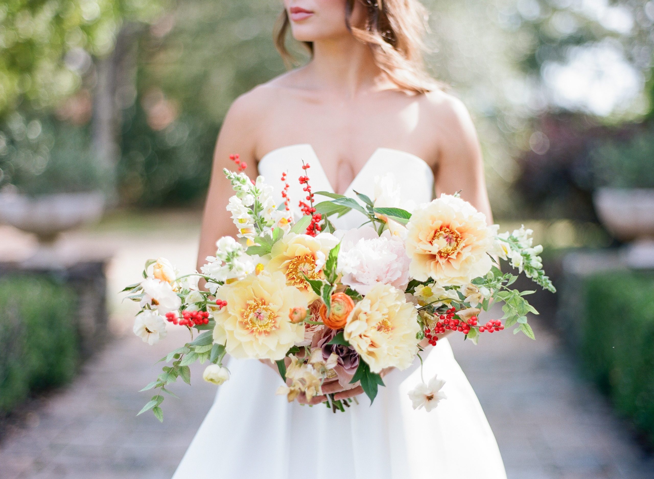 Bright colorful bouquet with yellow orange and pops of red Bouquet Inspiration photo