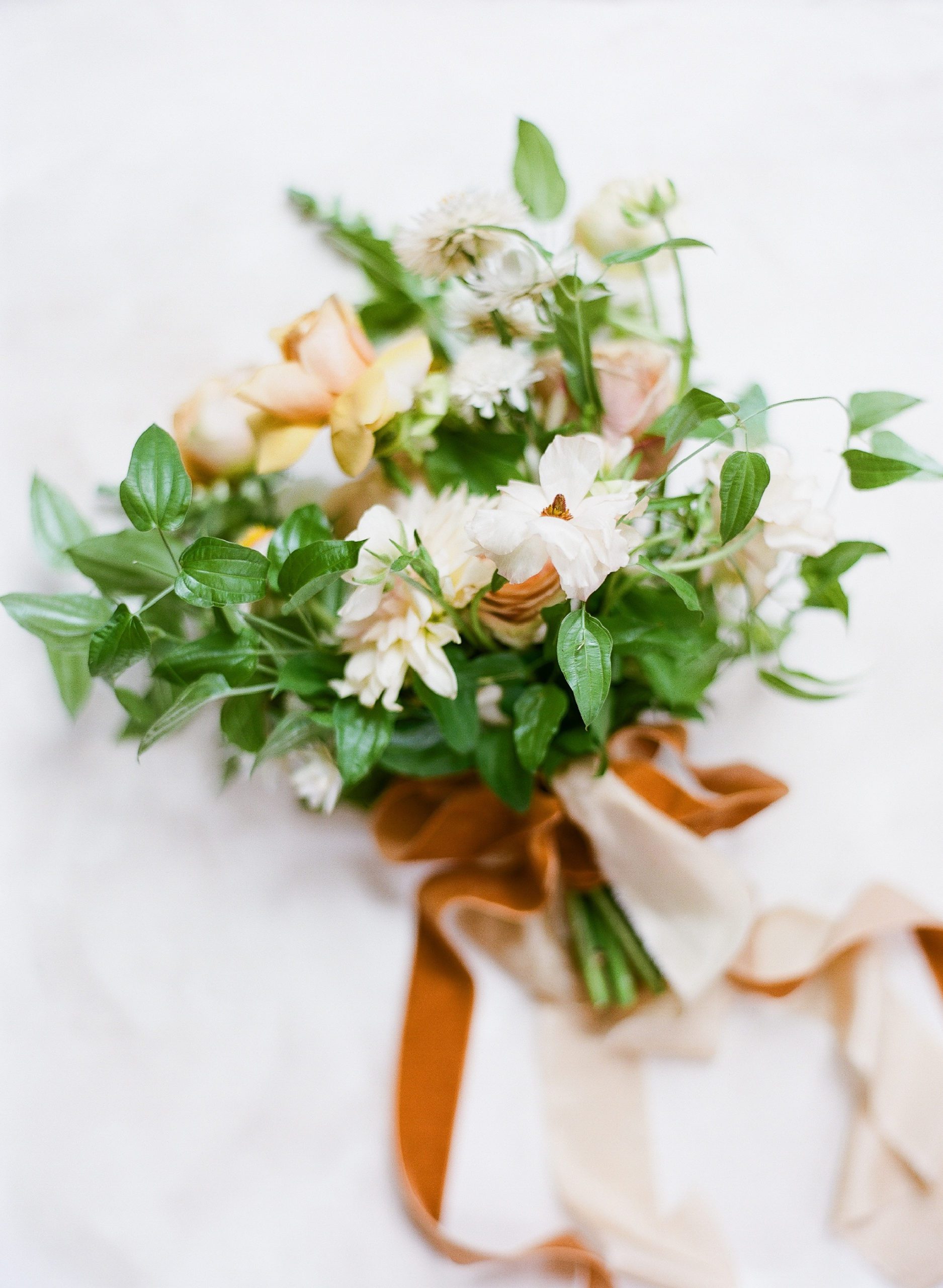 Bouquet Inspiration with yellow and white flowers and orange ribbon photo