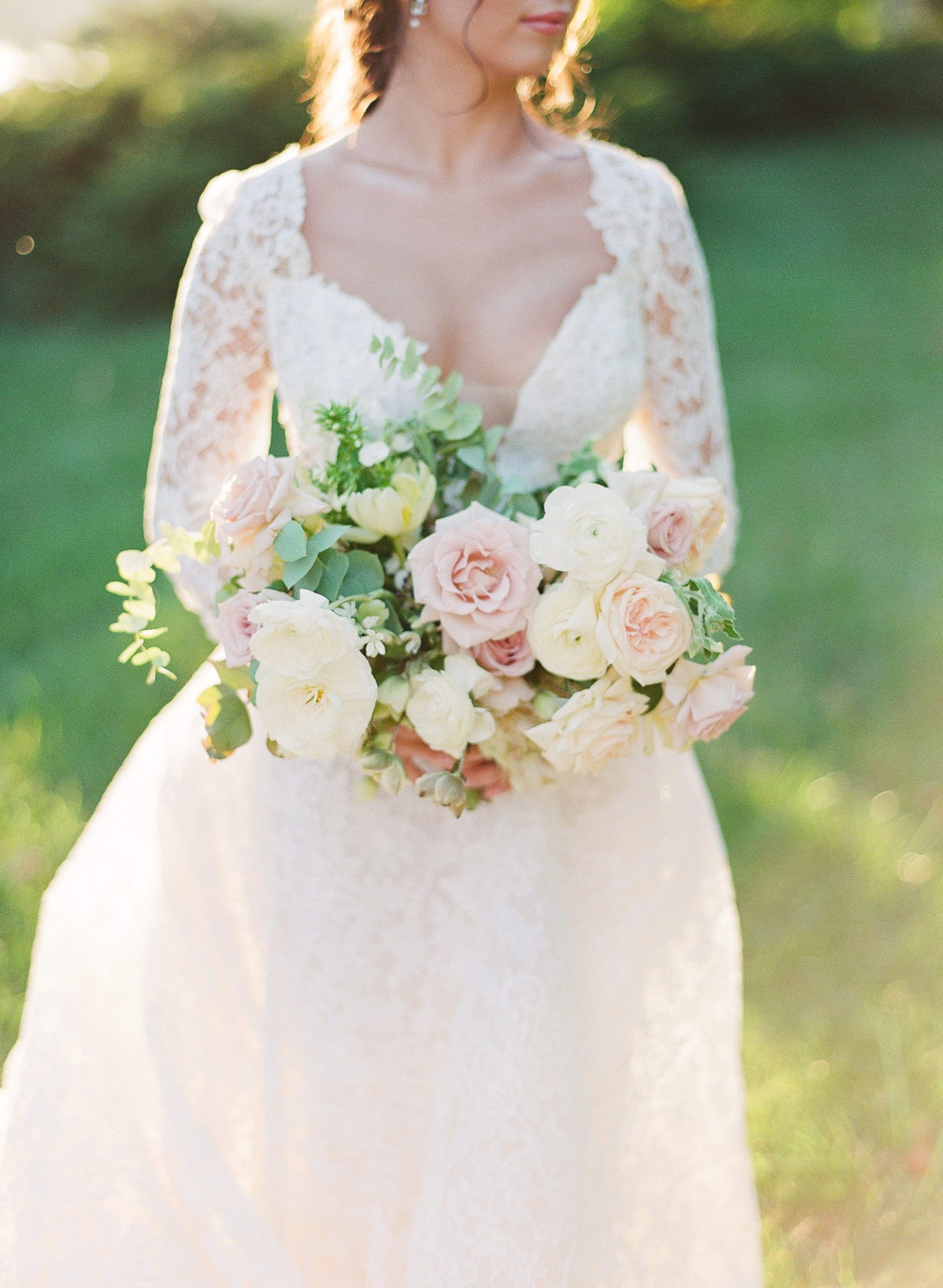 Bride Holding Blush and White Bridal Bouquet Photo