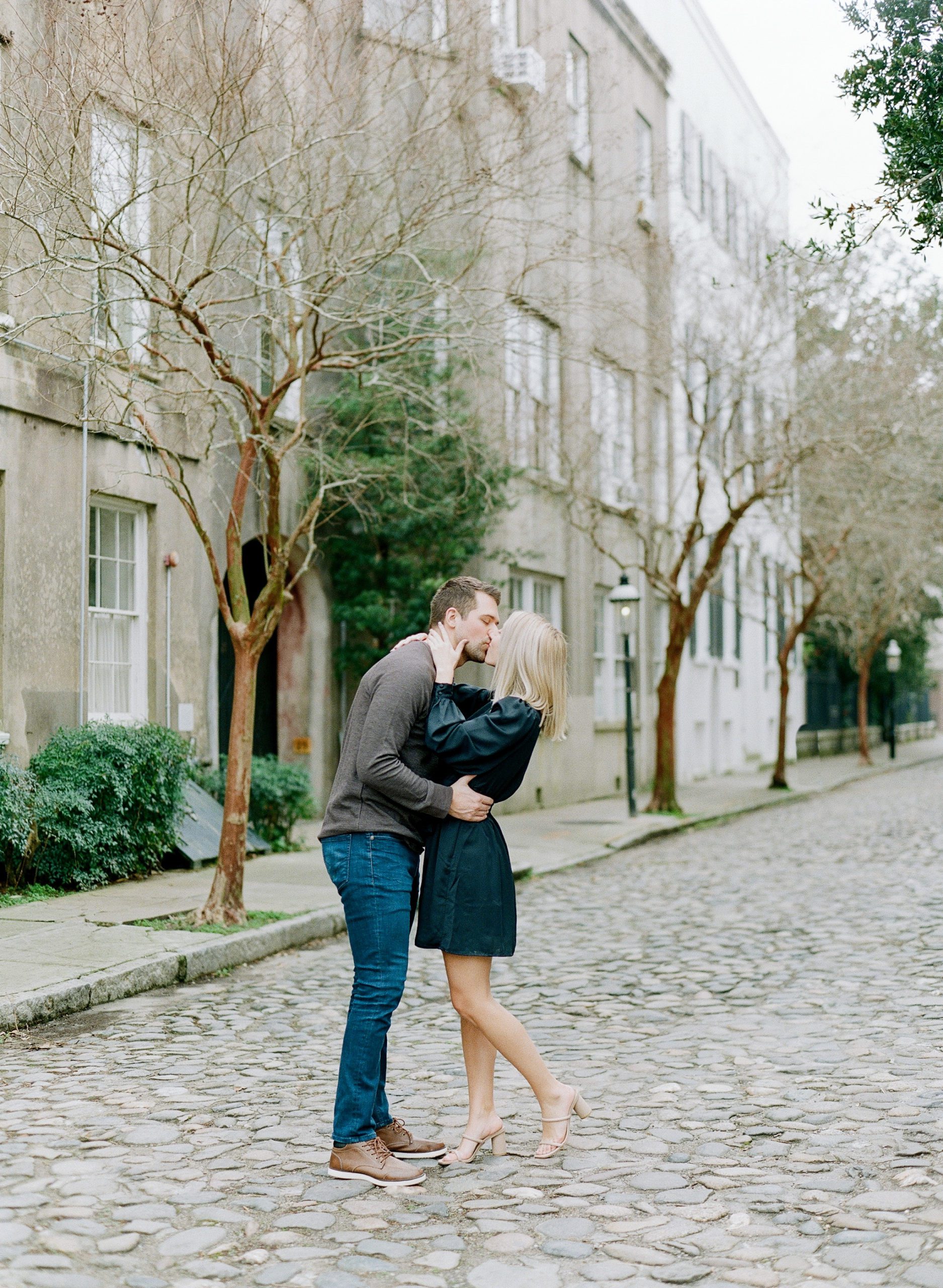 Charleston French Quarter Couple Kissing on Cobblestone Street Photo
