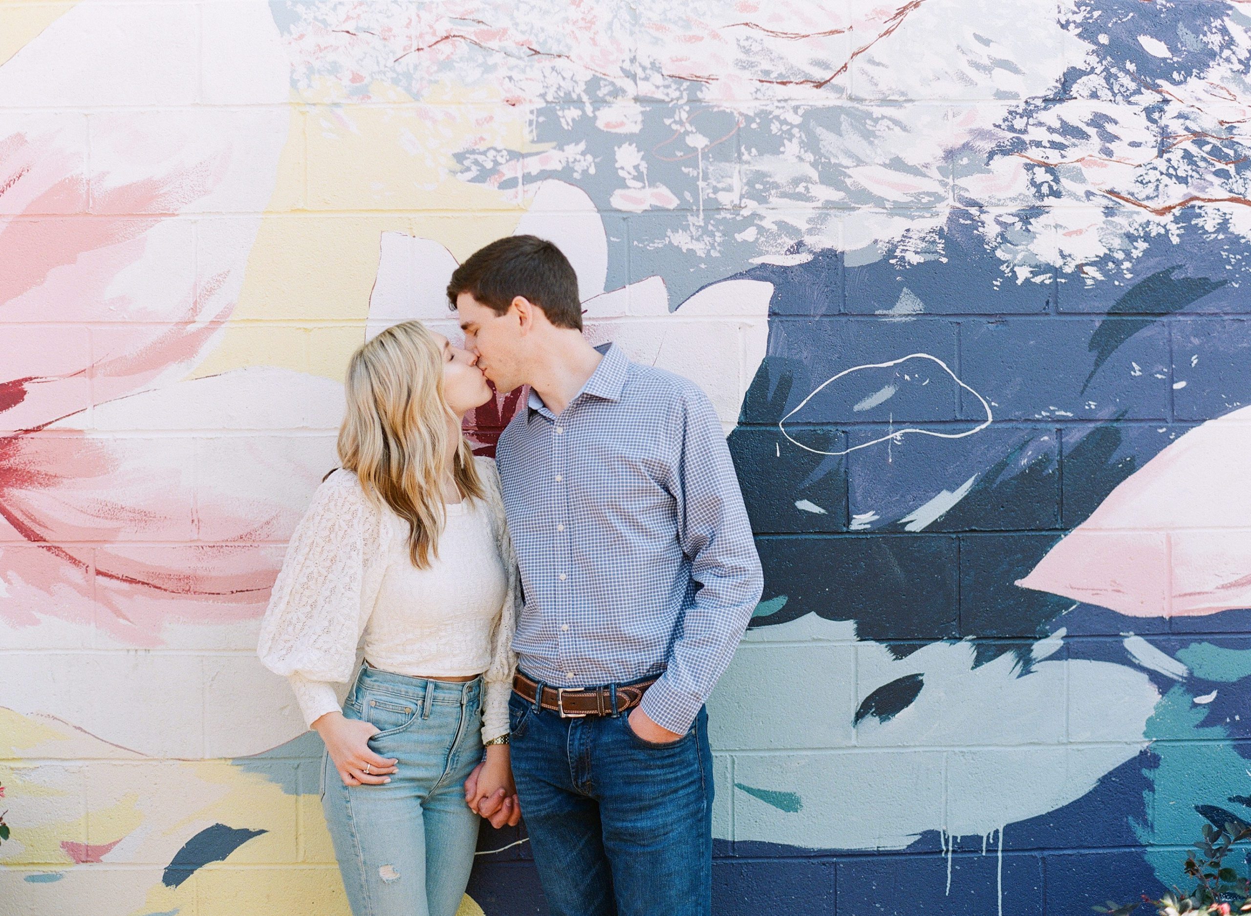 Marietta Square Couple Kissing in front of Mural Photo