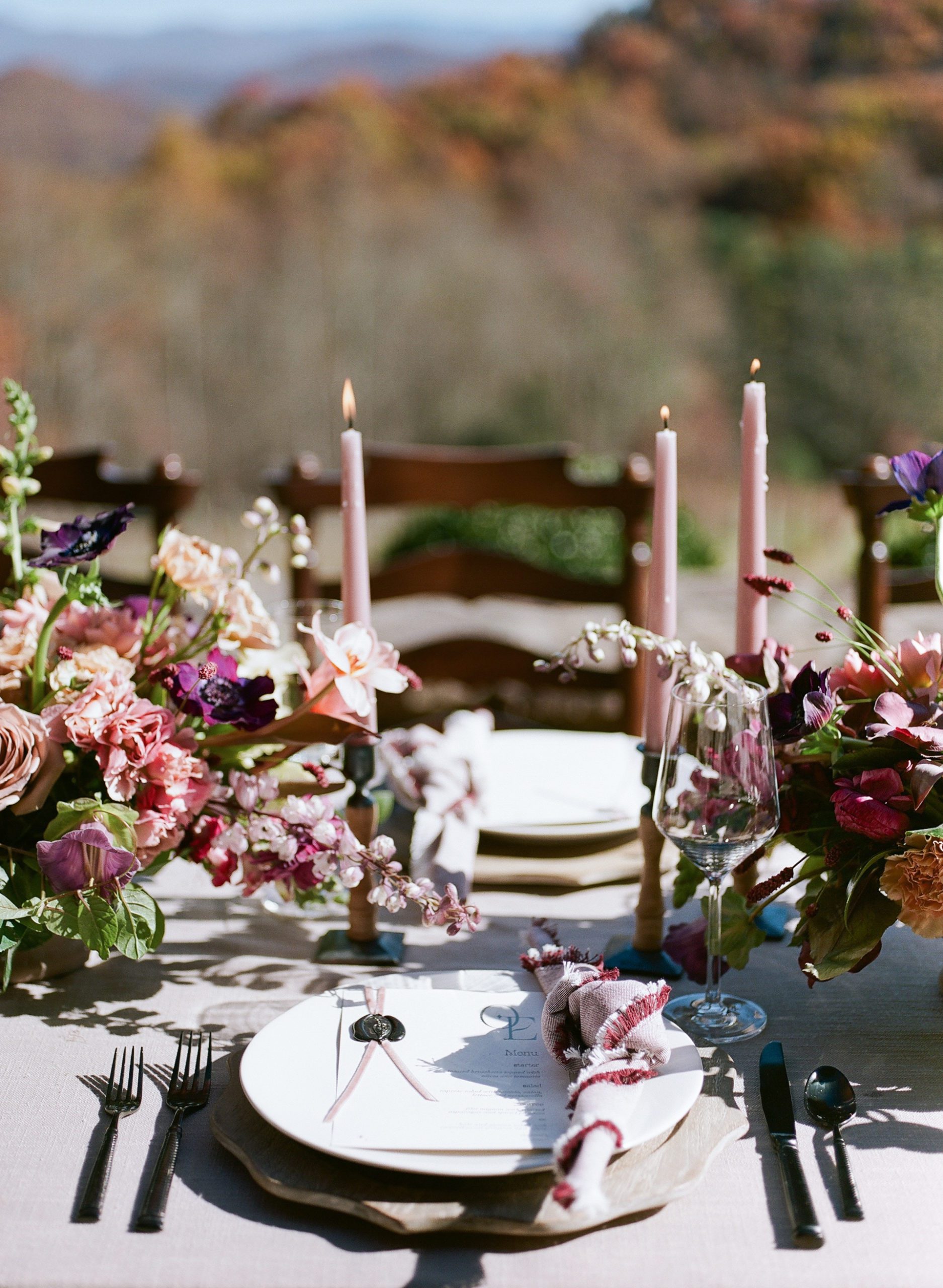 Wedding Reception Table with flowers and pillar candles photo