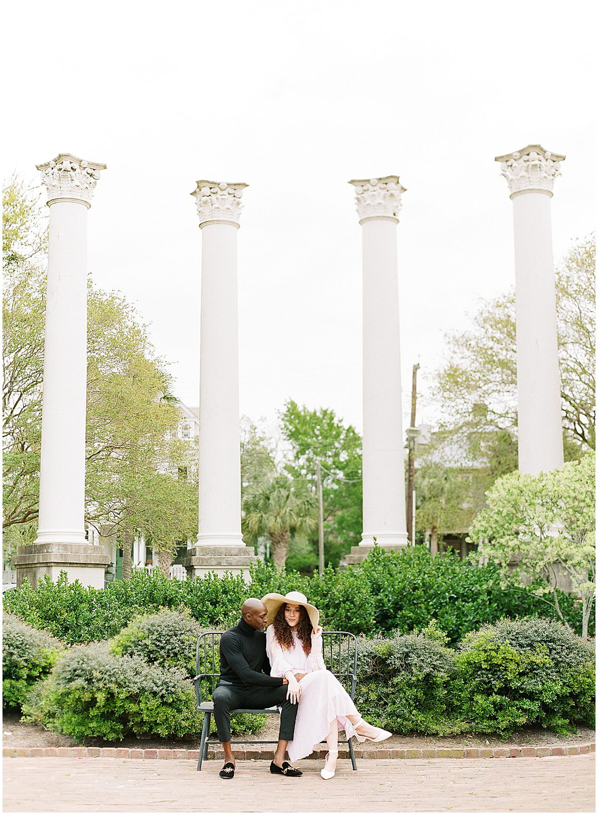 Couple Sitting on Bench at Canon Park During Charleston Engagement Photos