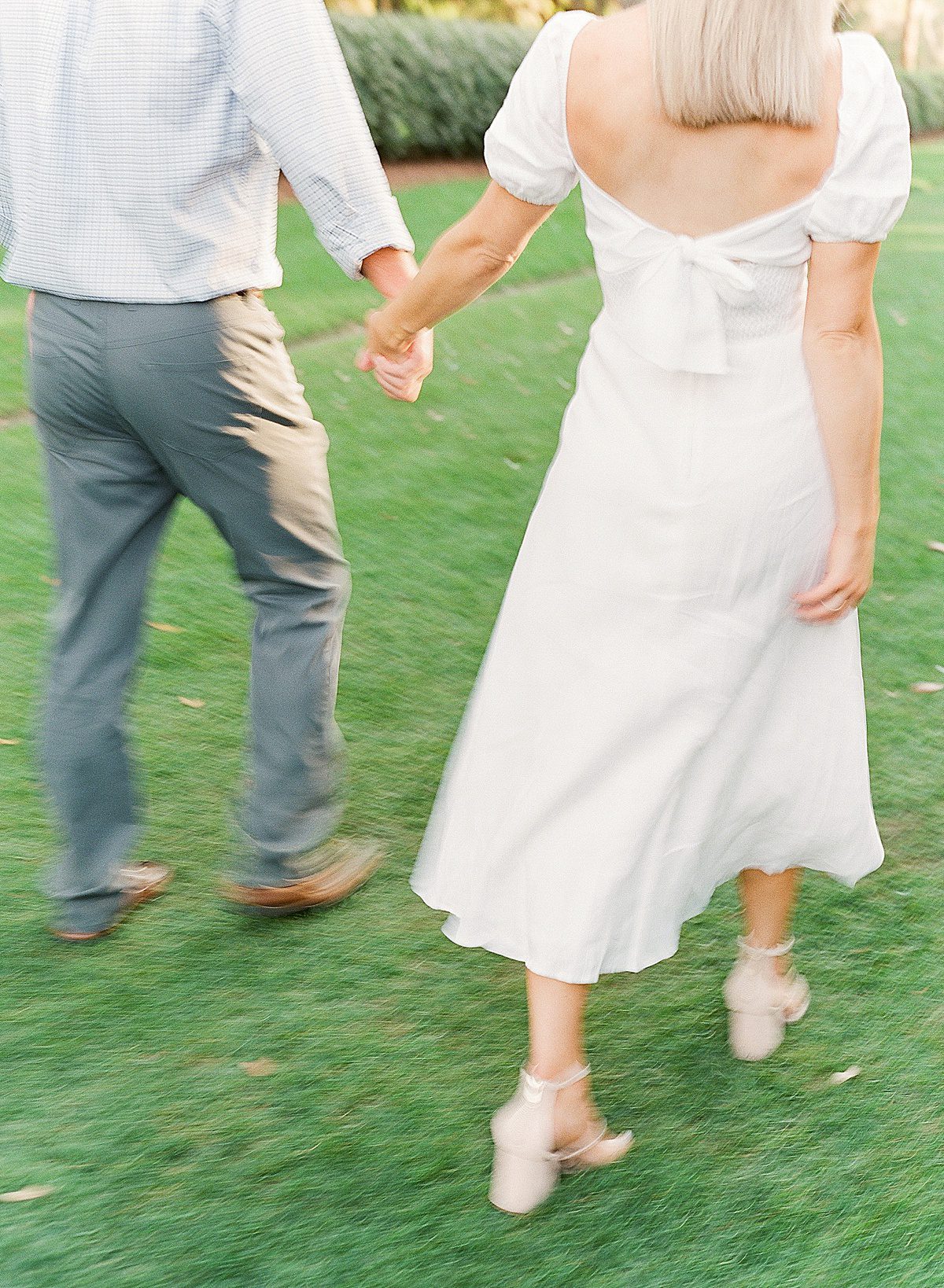 Couple Holding Hands walking away Blur Photo