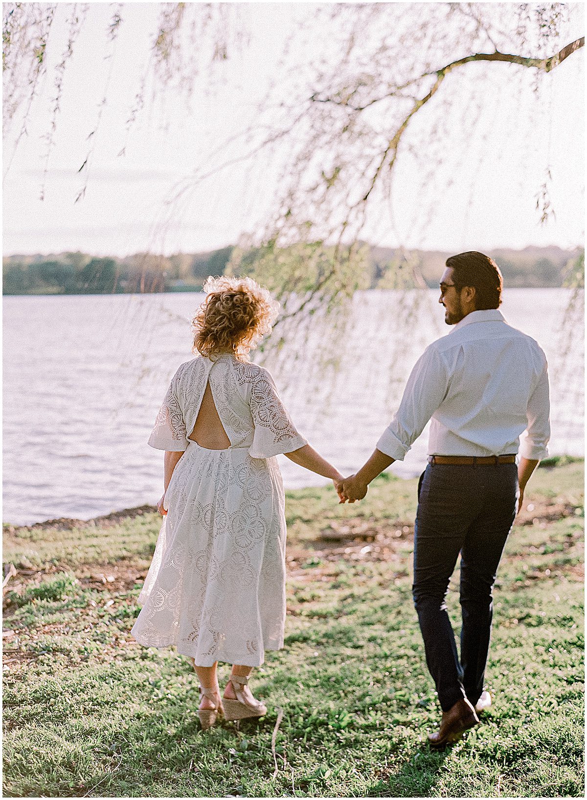 Couple Holding Hands By The Potomac River Photo