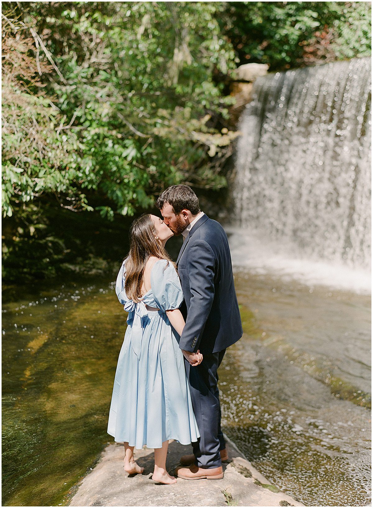 Couple Kissing at Waterfall Photo