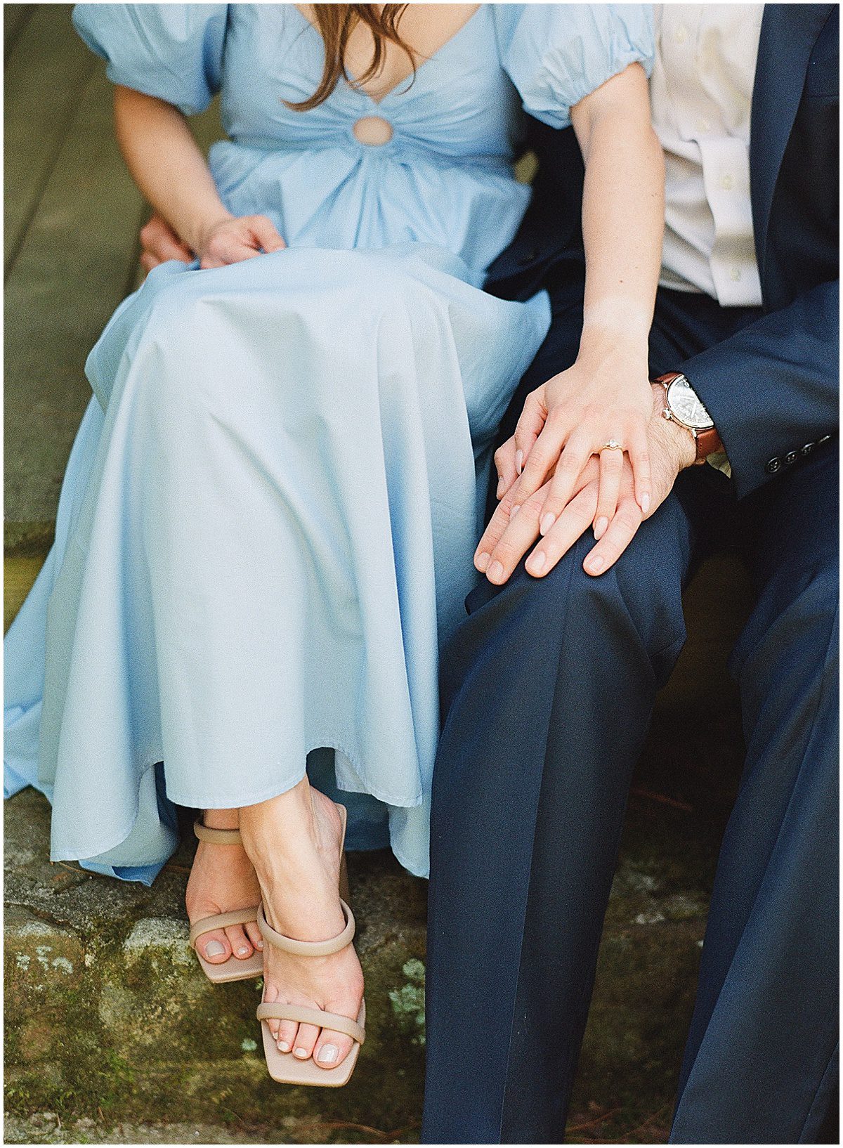 Couple Holding Hands Sitting Photo
