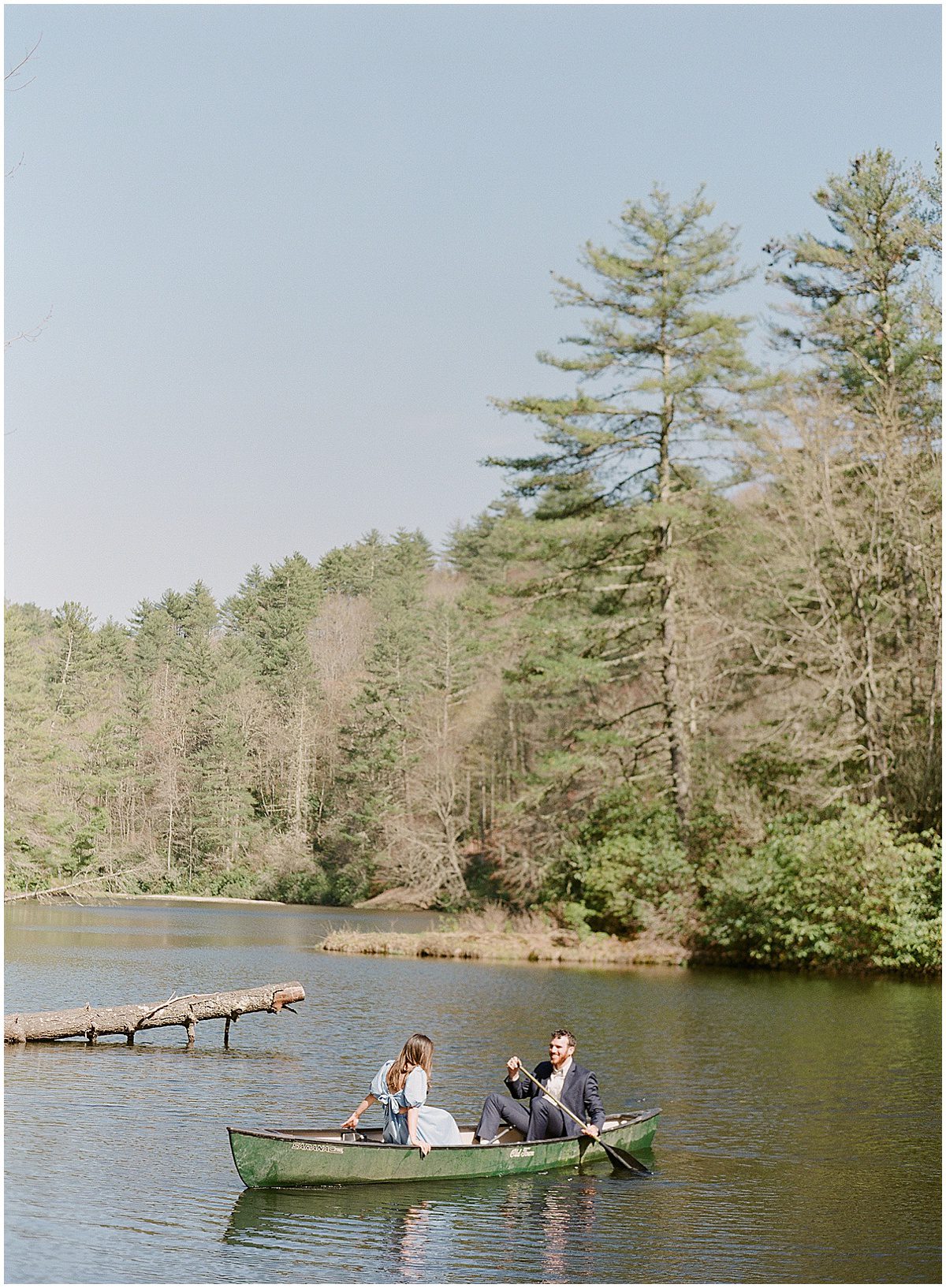 Couple In Canoe During Cashiers NC Engagement Session Photo