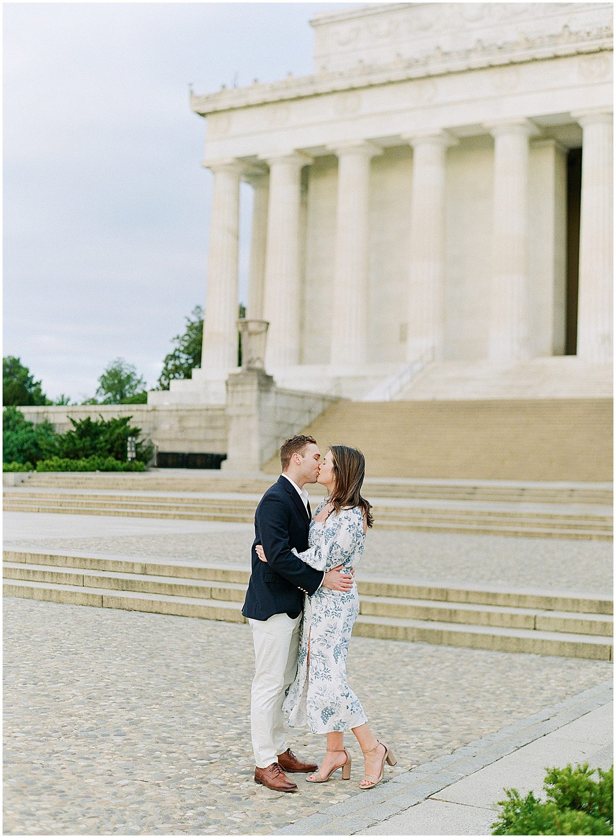 National Mall Engagement Photos Couple Kissing In Front of the Lincoln Memorial Photo