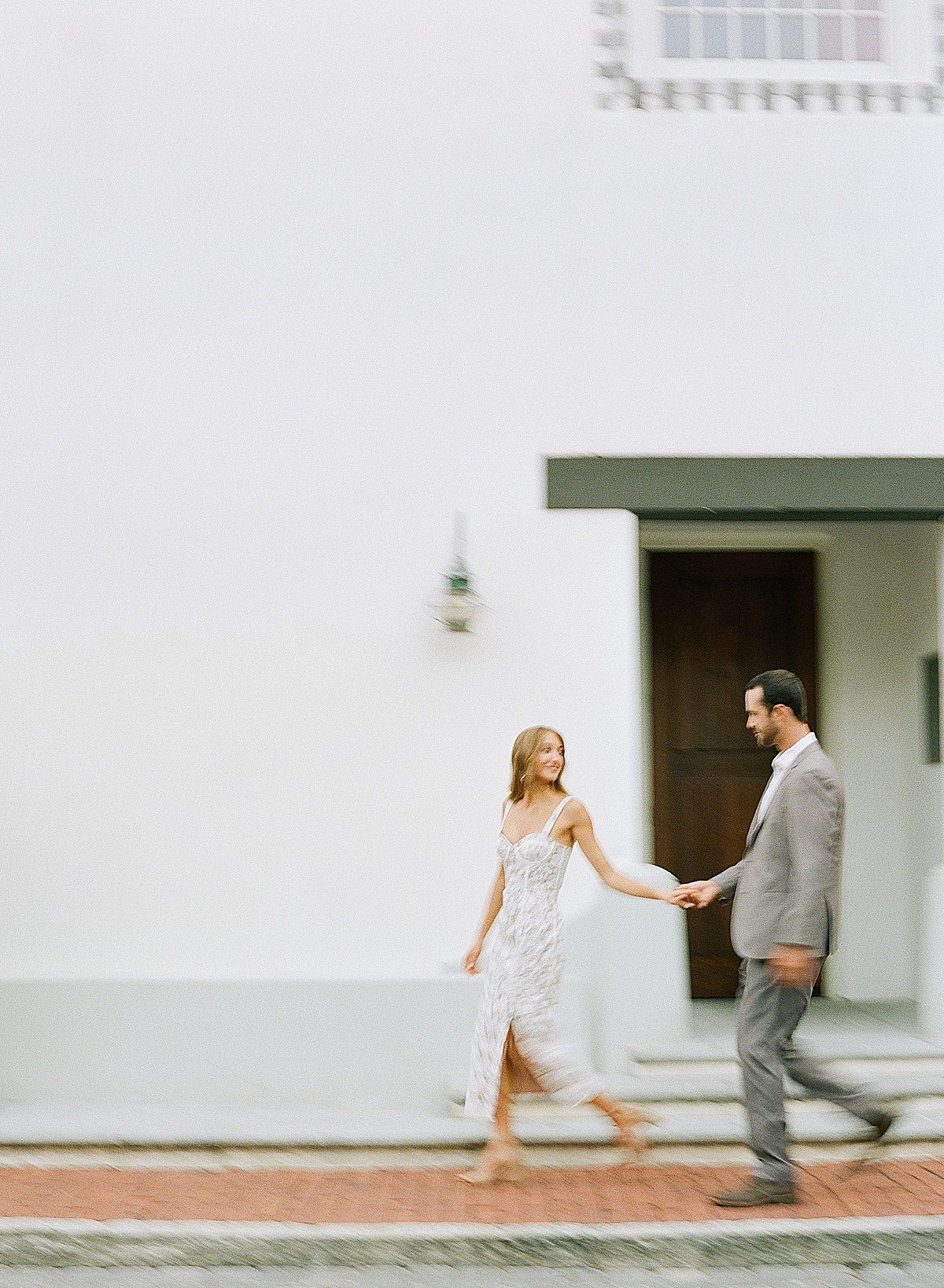 30A Wedding Photographer Captures Couple Walking in Motion Blur Photo