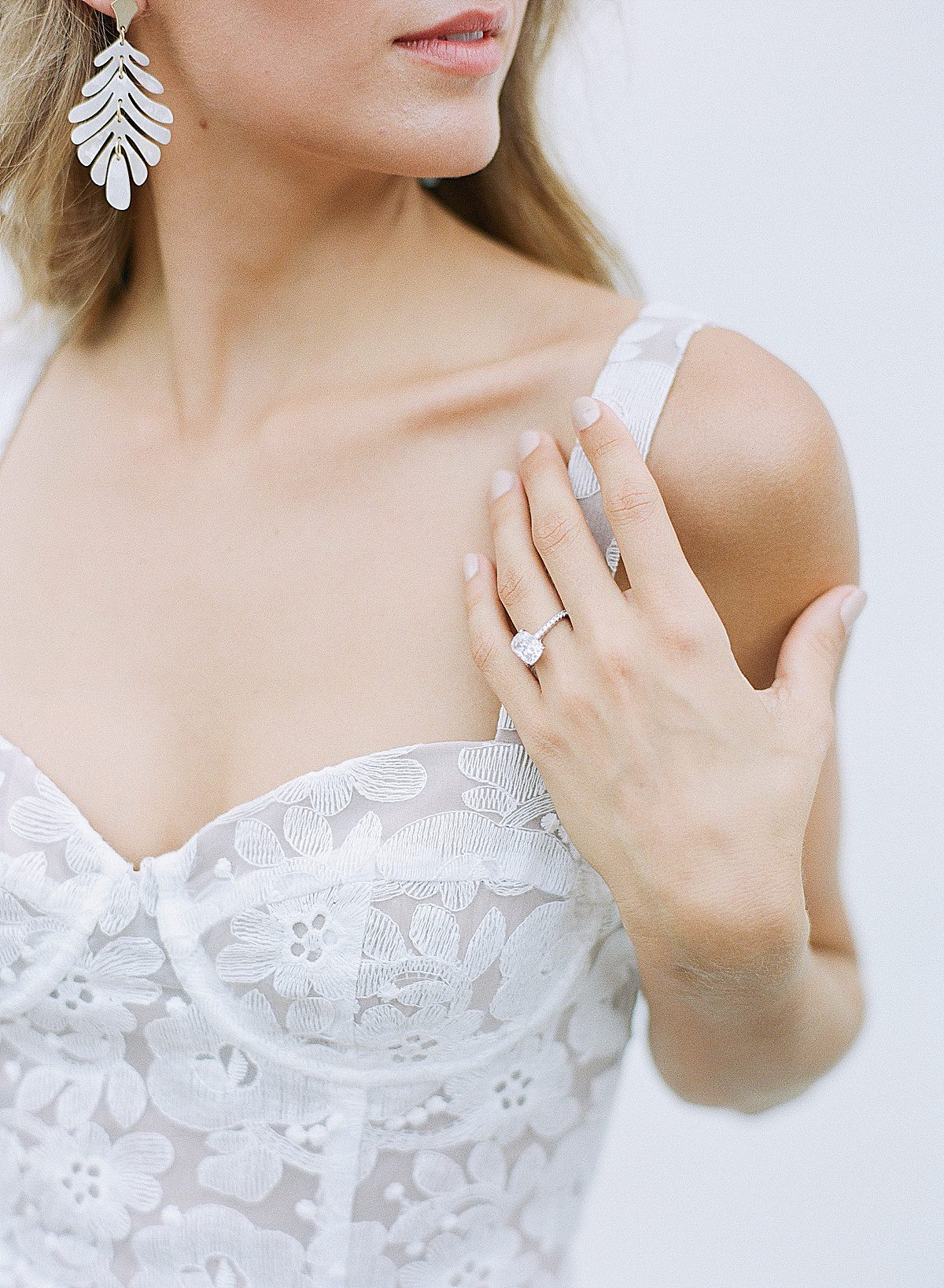Detail of Brides Dress and Earring Photo