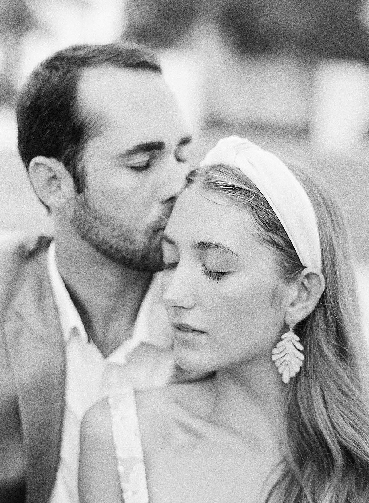 Black and White of Couple with Eyes Closed Captured by 30A Wedding Photographer Photo