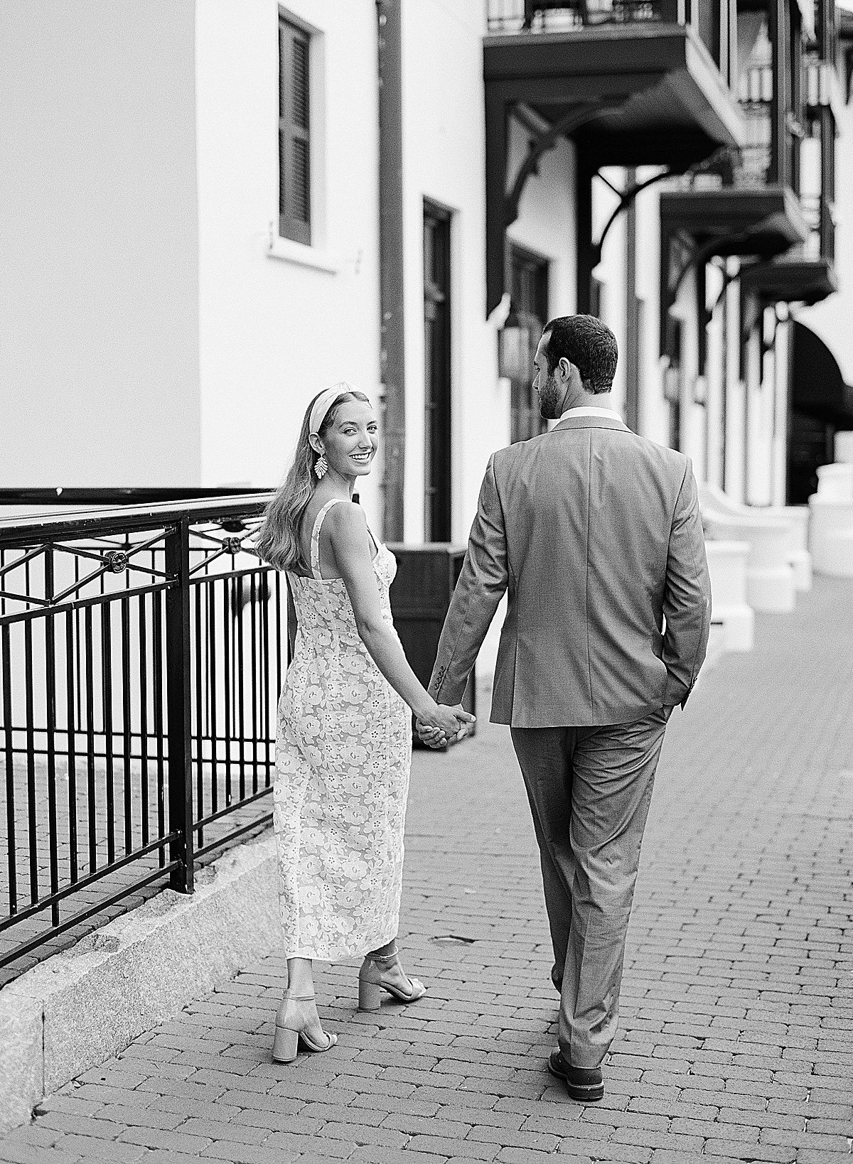 Black and White of Couple Walking Down Street in Rosemary Beach Florida Photo