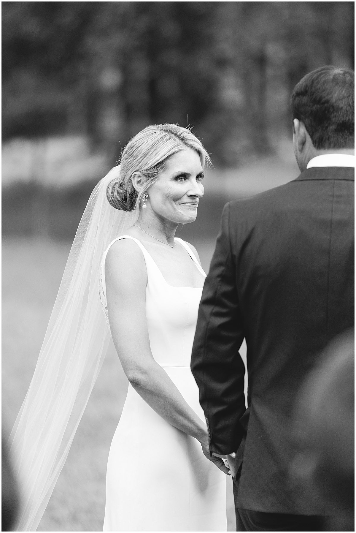 Black and White of Bride Smiling at Groom Photo